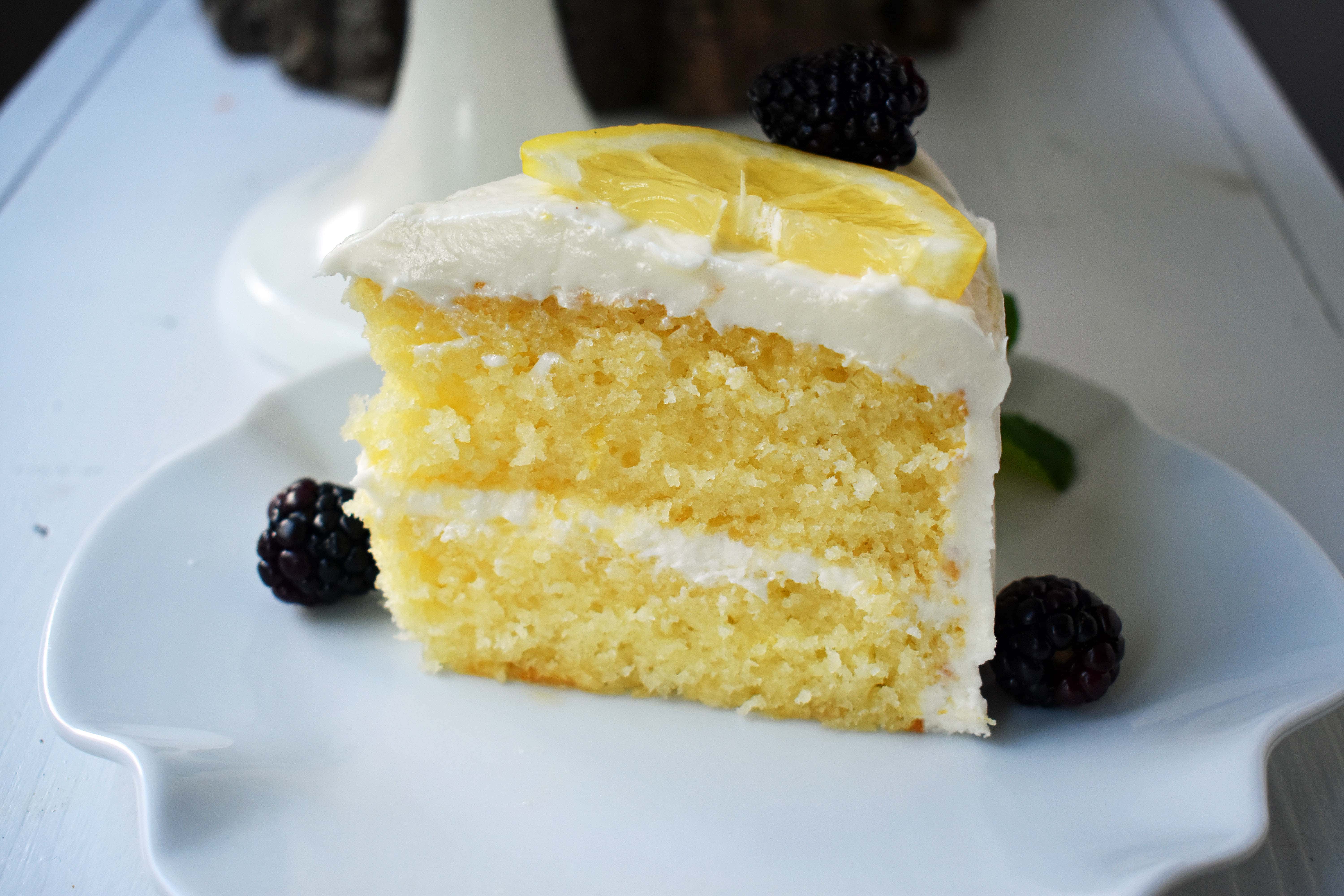 Italian Lemon Olive Oil Cake. Soft and tender moist lemon cake topped with lemon vanilla cream cheese frosting. The perfect lemon cake! www.modernhoney.com