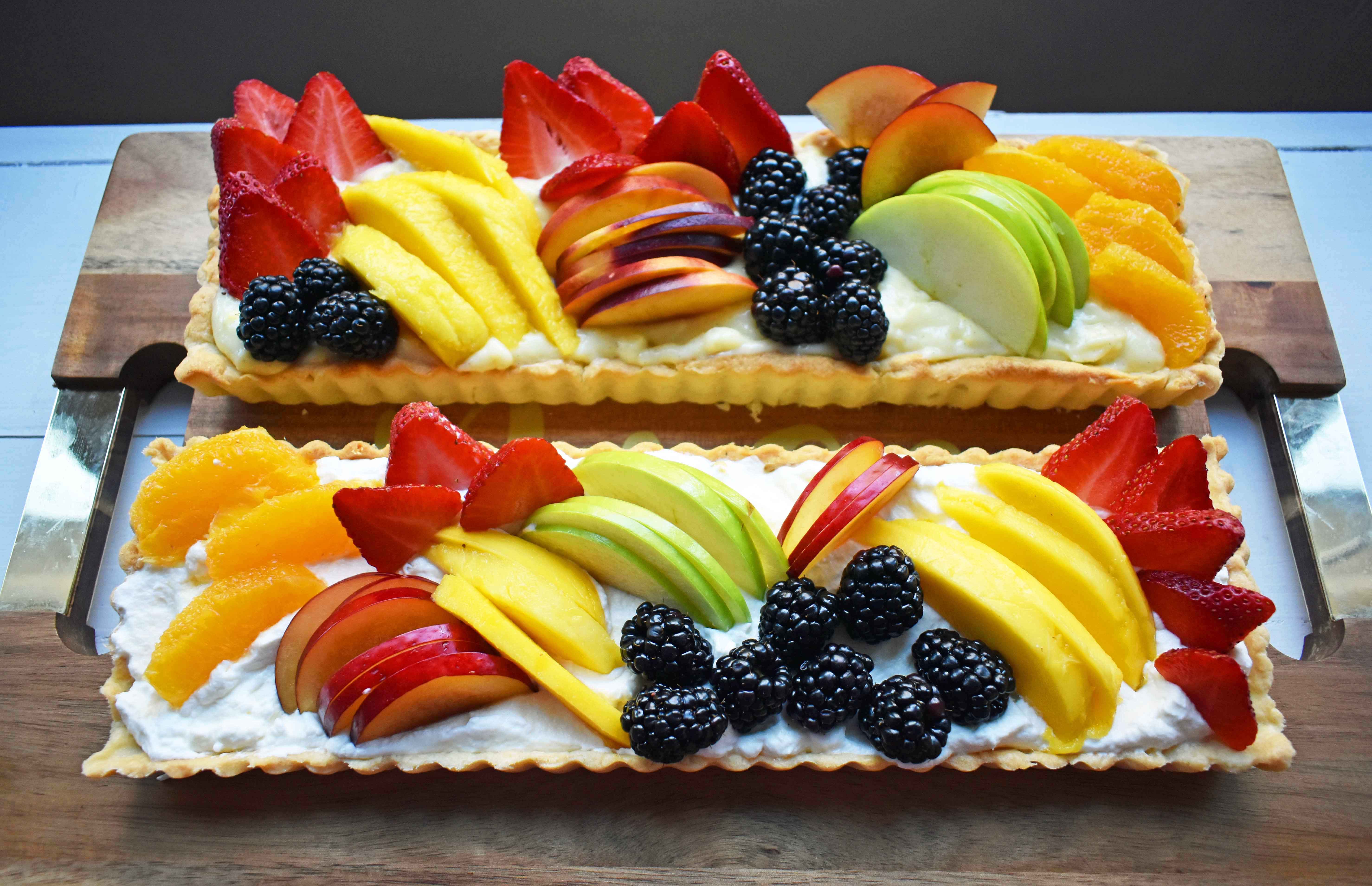 Fresh Fruit Tart with Vanilla Pastry Cream. Buttery, flaky tart filled with homemade vanilla bean custard and topped with fresh fruits. A classic French dessert that is a huge crowd pleaser. www.modernhoney.com