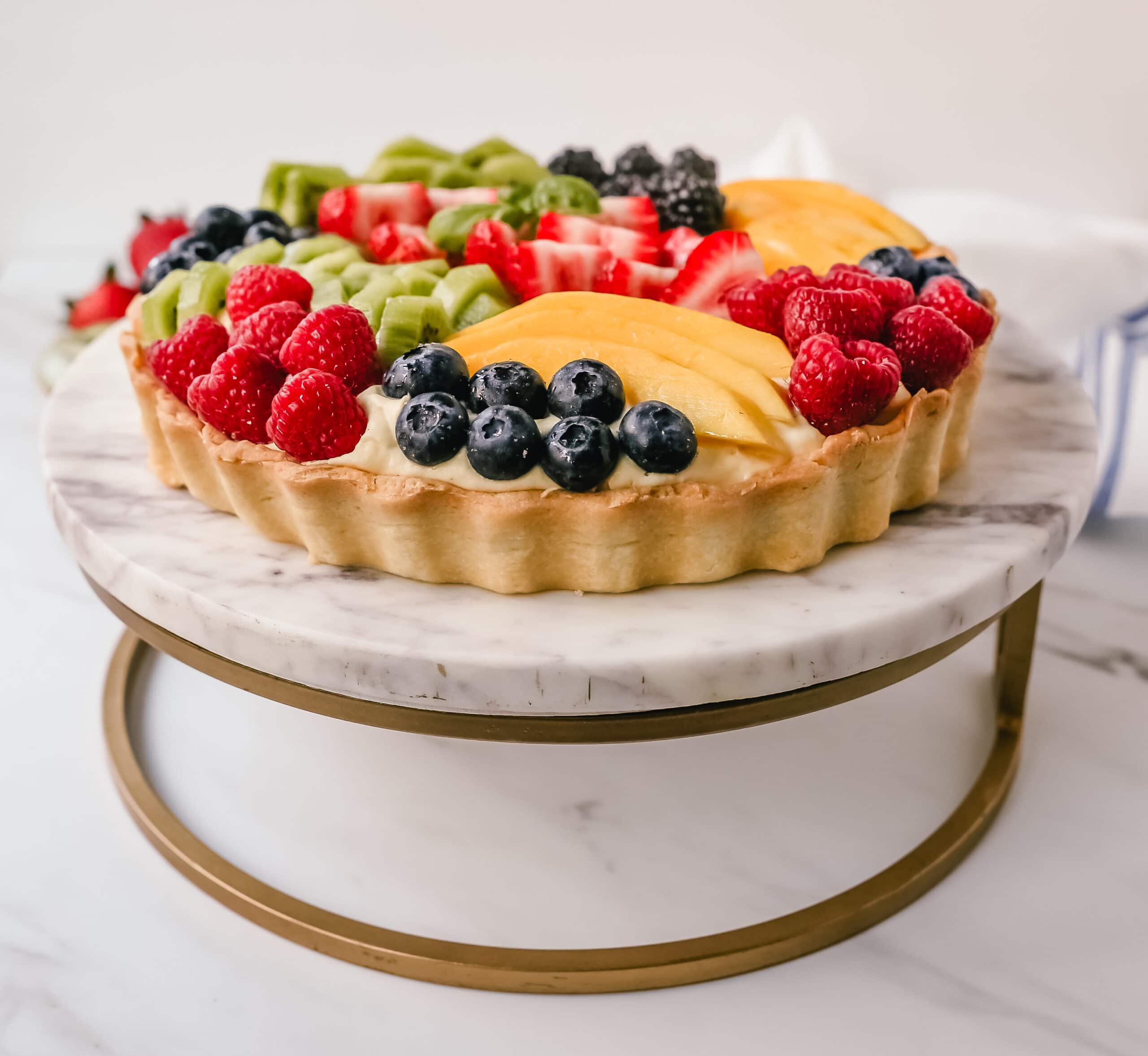 Fruit Tart with Pastry Cream This French fruit tart is made with a flaky, buttery pie crust, filled with homemade vanilla bean pastry cream, and topped with fresh fruit.