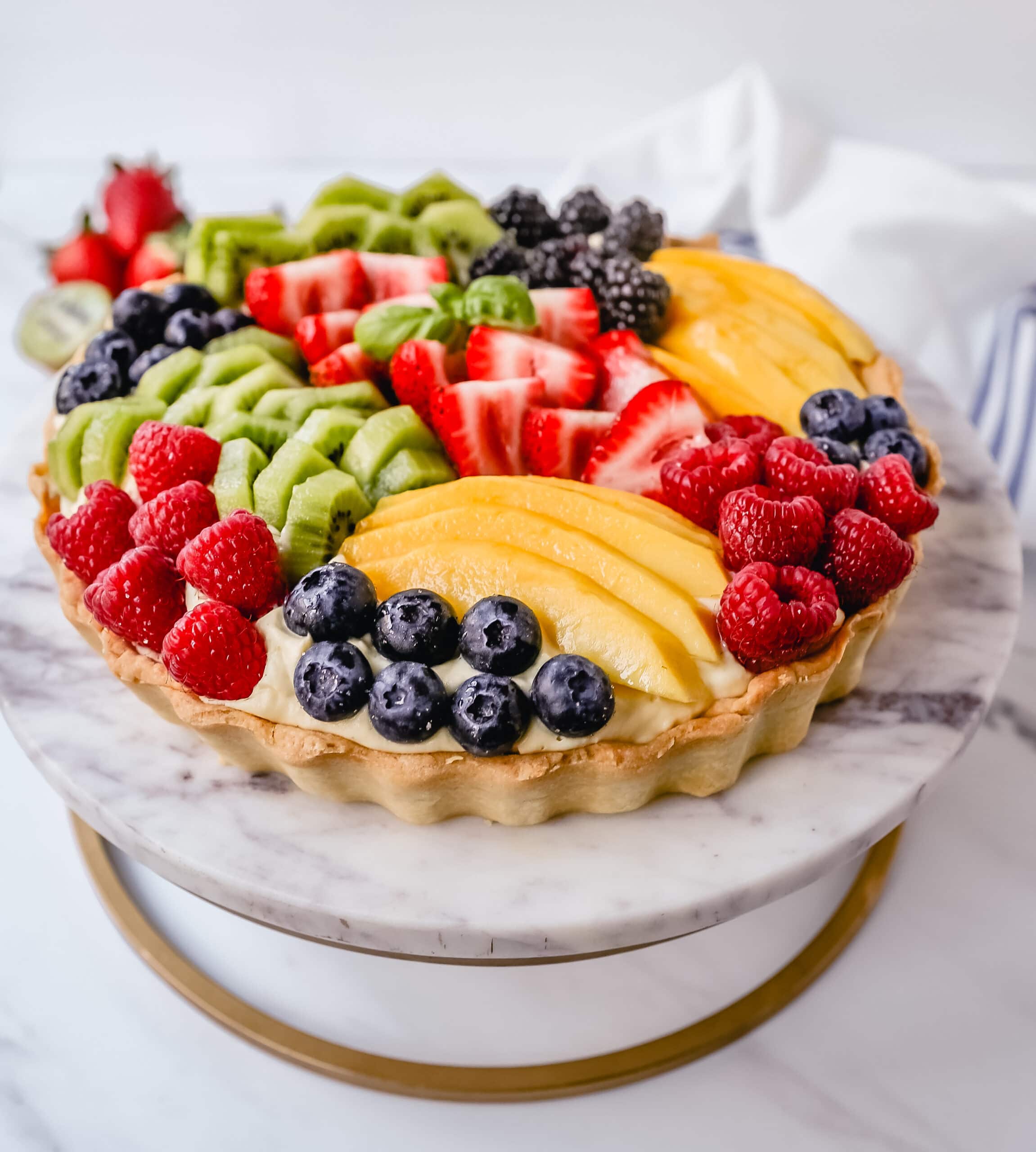 Fruit Tart with Pastry Cream This French fruit tart is made with a flaky, buttery pie crust, filled with homemade vanilla bean pastry cream, and topped with fresh fruit.