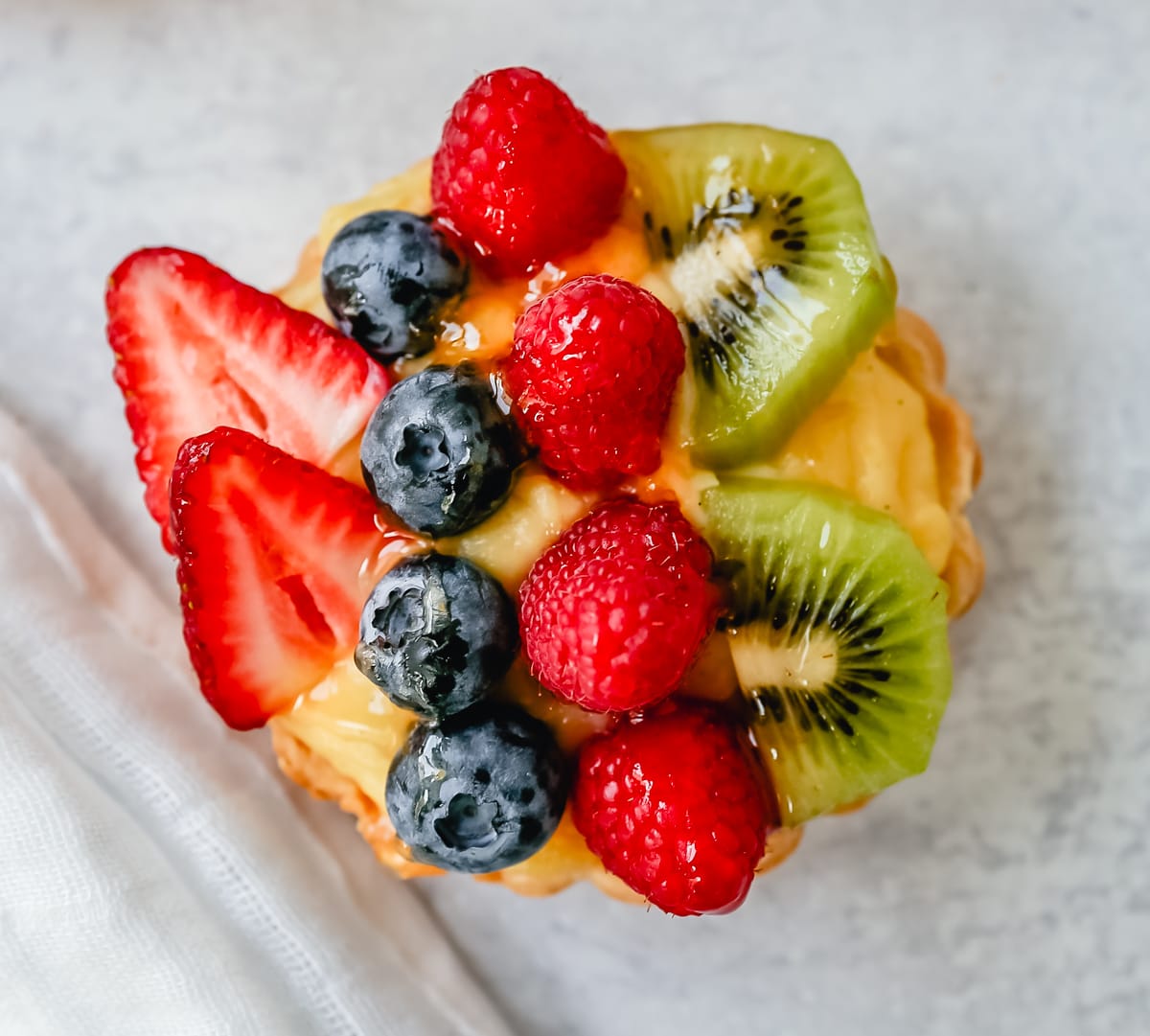 Fruit Tart with Pastry Cream This French fruit tart is made with a flaky, buttery pie crust, filled with homemade vanilla bean pastry cream, and topped with fresh fruit.