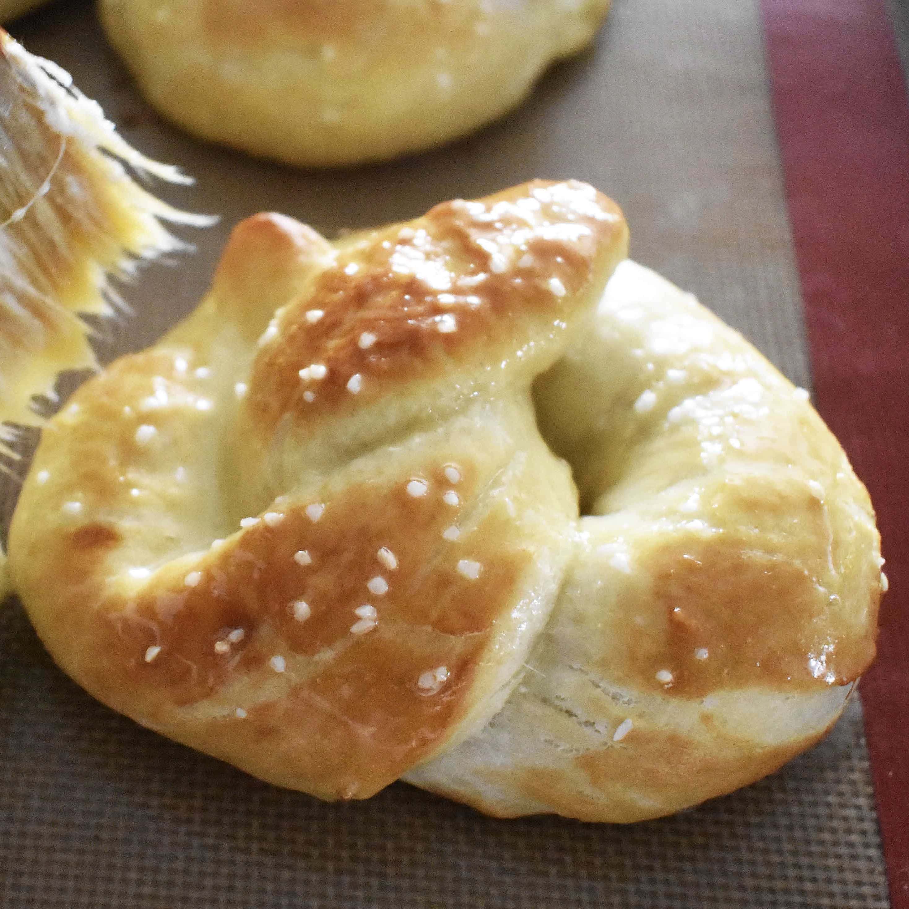 Buttery Soft Pretzels. Homemade, made from scratch soft pretzels. Buttery, soft, and fluffy pretzels with melted butter and coarse salt. Super easy to make! www.modernhoney.com