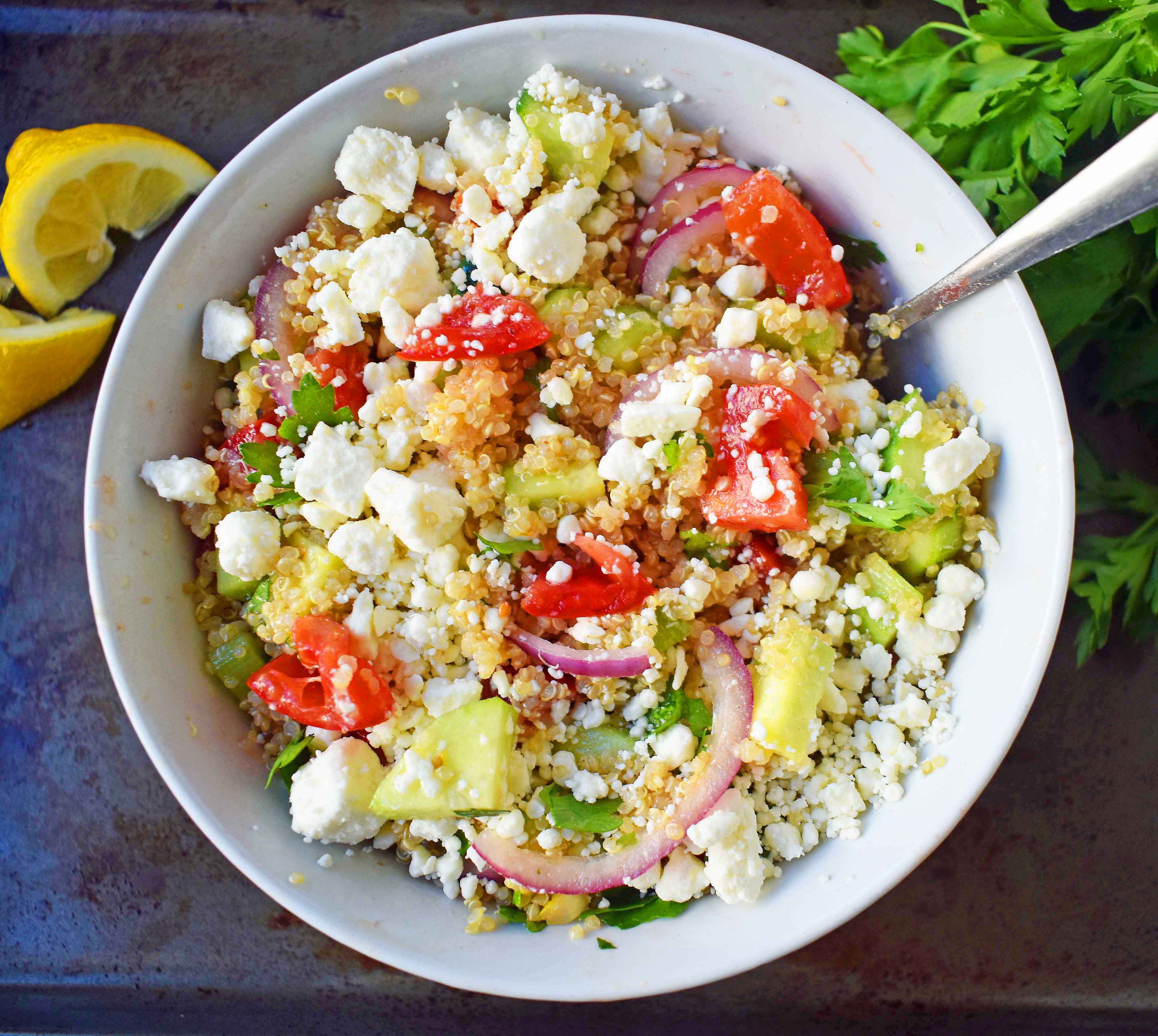 Mediterranean Quinoa Salad with feta cheese, tomatoes, cucumber, and red onions, all tossed in a red wine vinaigrette. www.modernhoney.com