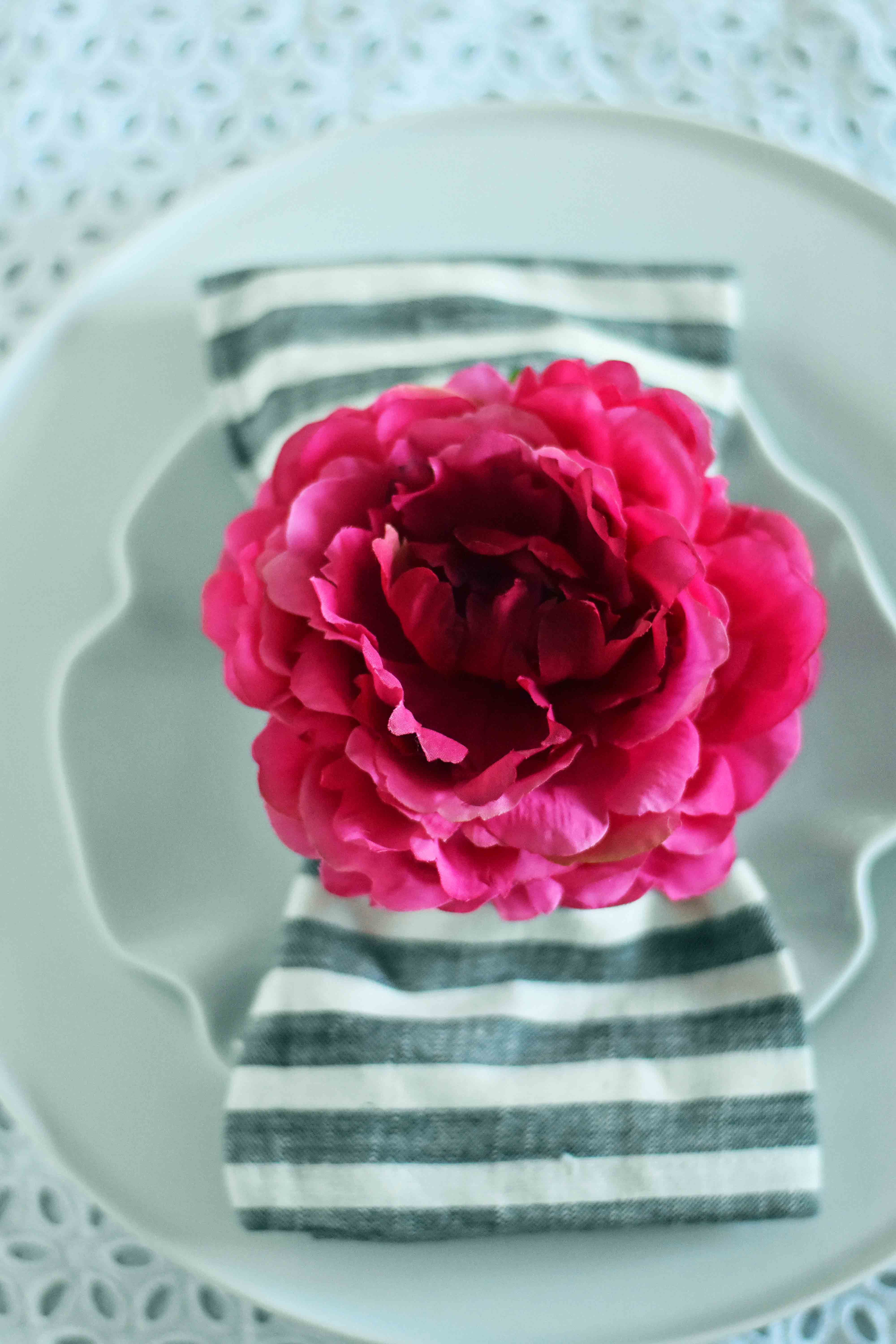 How to decorate for Spring. Beautiful Spring tablescapes. DIY decorating ideas for Spring. How to decorate your table for Spring. Pink Peonies Napkin Ring from Pier 1 Imports. Magnolia Striped Napkins from Joanna Gaines Hearth and Hand collection at Target. www.modernhoney.com