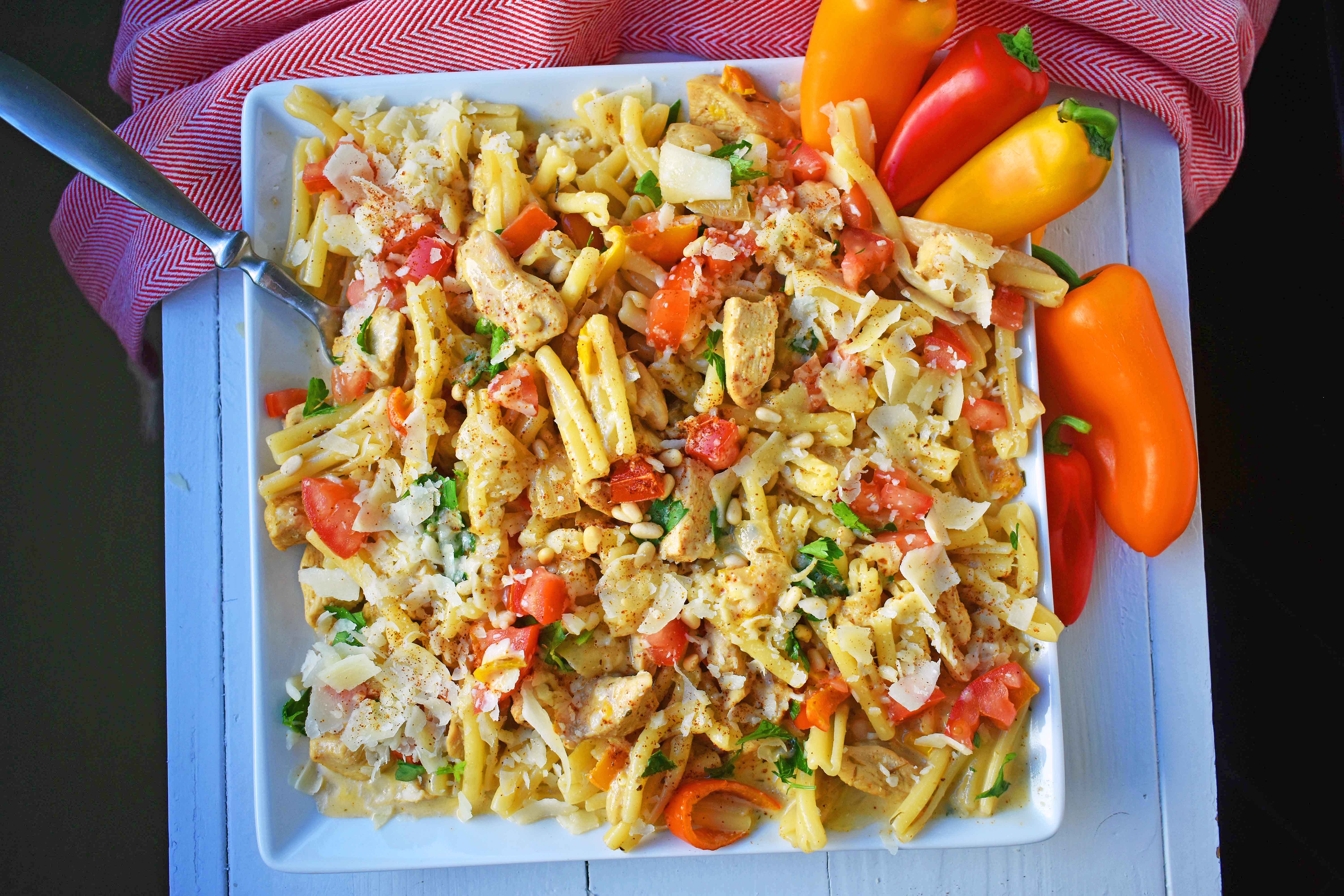 Cajun Louisiana Chicken Pasta made with onions, peppers, chicken, and cajun cream tossed with your favorite kind of pasta and topped with parmesan cheese and pine nuts. A super flavorful creamy pasta dish. www.modernhoney.com