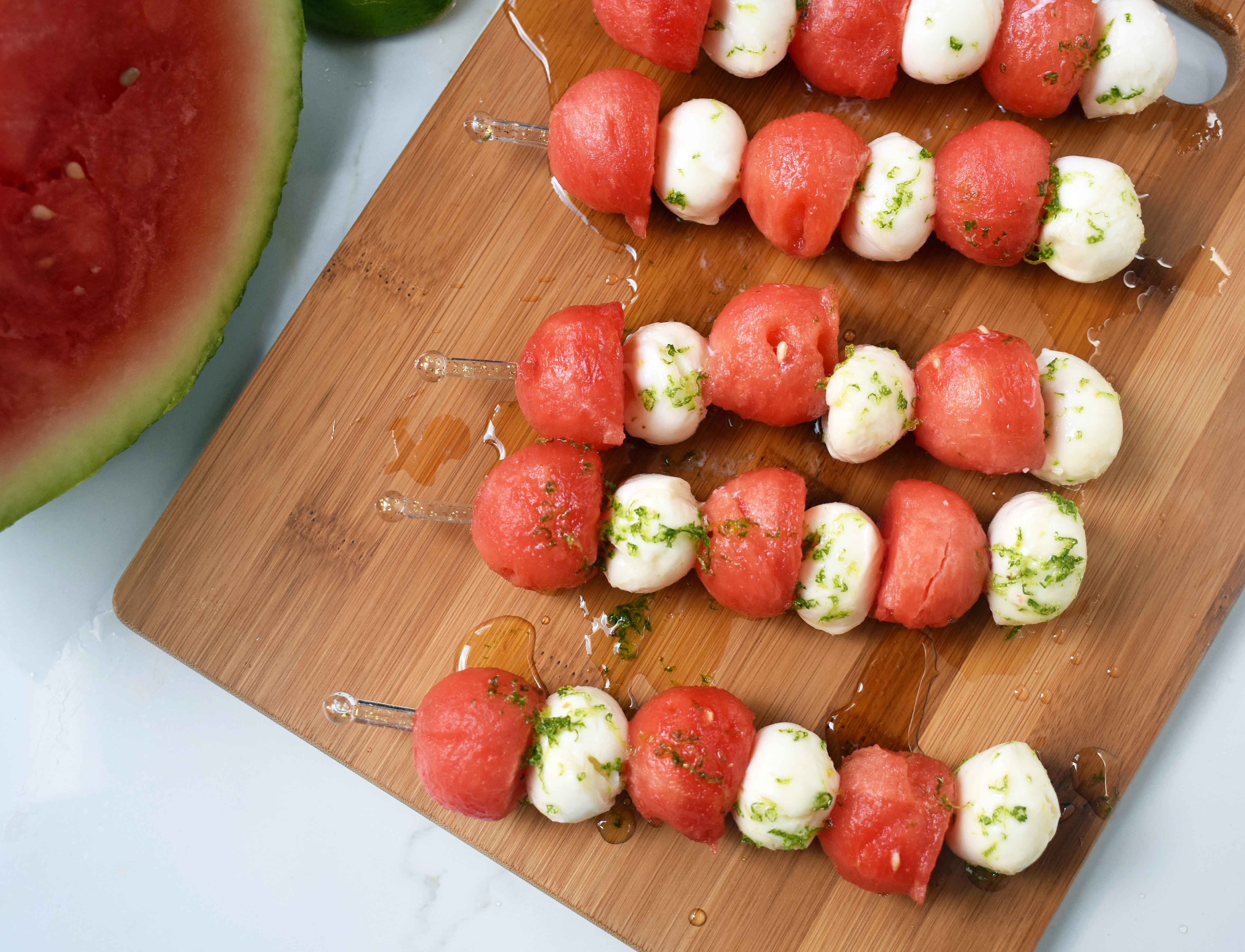 Fresh Mozzarella Watermelon Skewers with Honey Lime Drizzle. Round watermelon and fresh mozzarella balls and layered to make a kabob and drizzled with homemade honey lime sauce. A perfect appetizer or side dish for any BBQ or party. www.modernhoney.com