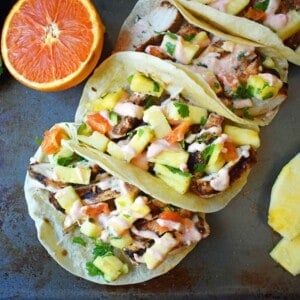 Jamaican Jerk Chicken Tacos. Caribbean spiced citrus grilled chicken filled tacos with pineapple salsa and spicy cream. www.modernhoney.com