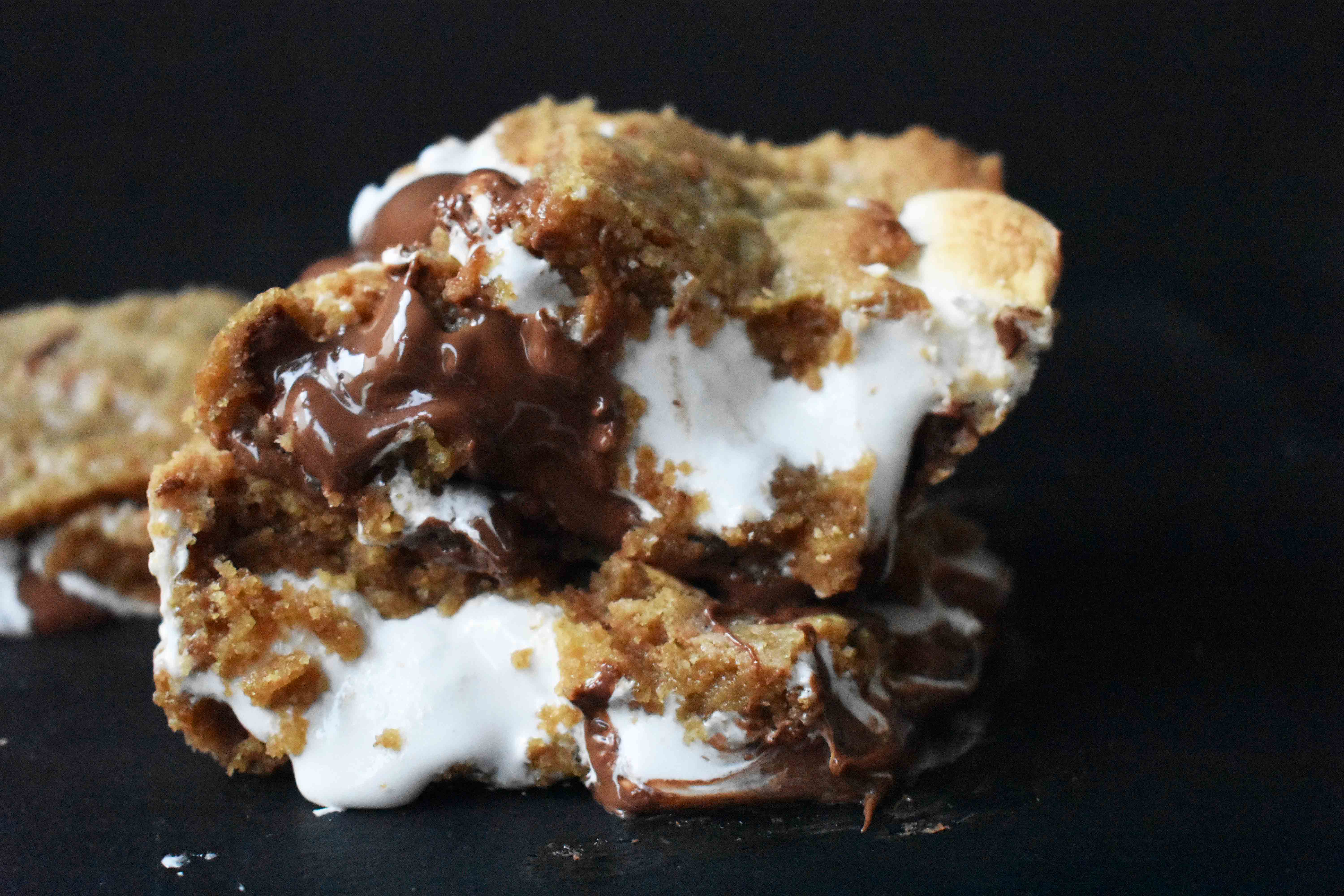 S'mores Bars made with homemade graham cracker cookie dough, marshmallow fluff, and milk chocolate bars. The popular s'more made into a cookie bar. www.modernhoney.com