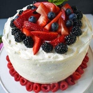 Berry Chantilly Cream Cake. Layers of perfect yellow cake, chantilly cream, jam, and fresh strawberries, raspberries, blackberries, and blueberries. The perfect Spring and Summer dessert that everyone will love. www.modernhoney.com