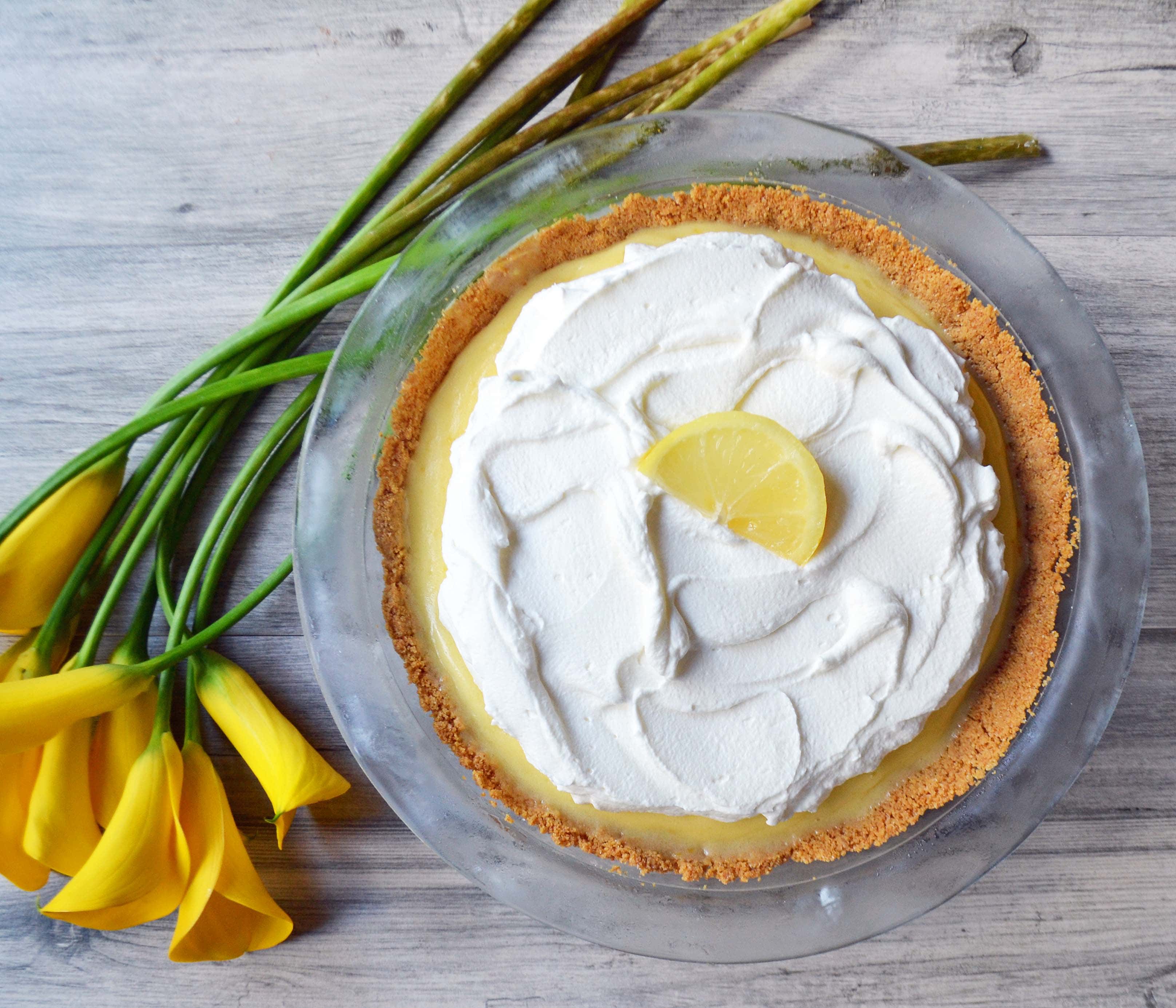 Lemon Cream Parfait Pie Jars. Homemade lemon curd layered with graham or butter cookie crust and sweetened cream cheese and whipped cream. The perfect dessert for parties, Mother's Day, Spring, or Summer parties. It's a lemon cream pie in a jar. Also, tips on how to make it into a 9 inch lemon cream pie. www.modernhoney.com