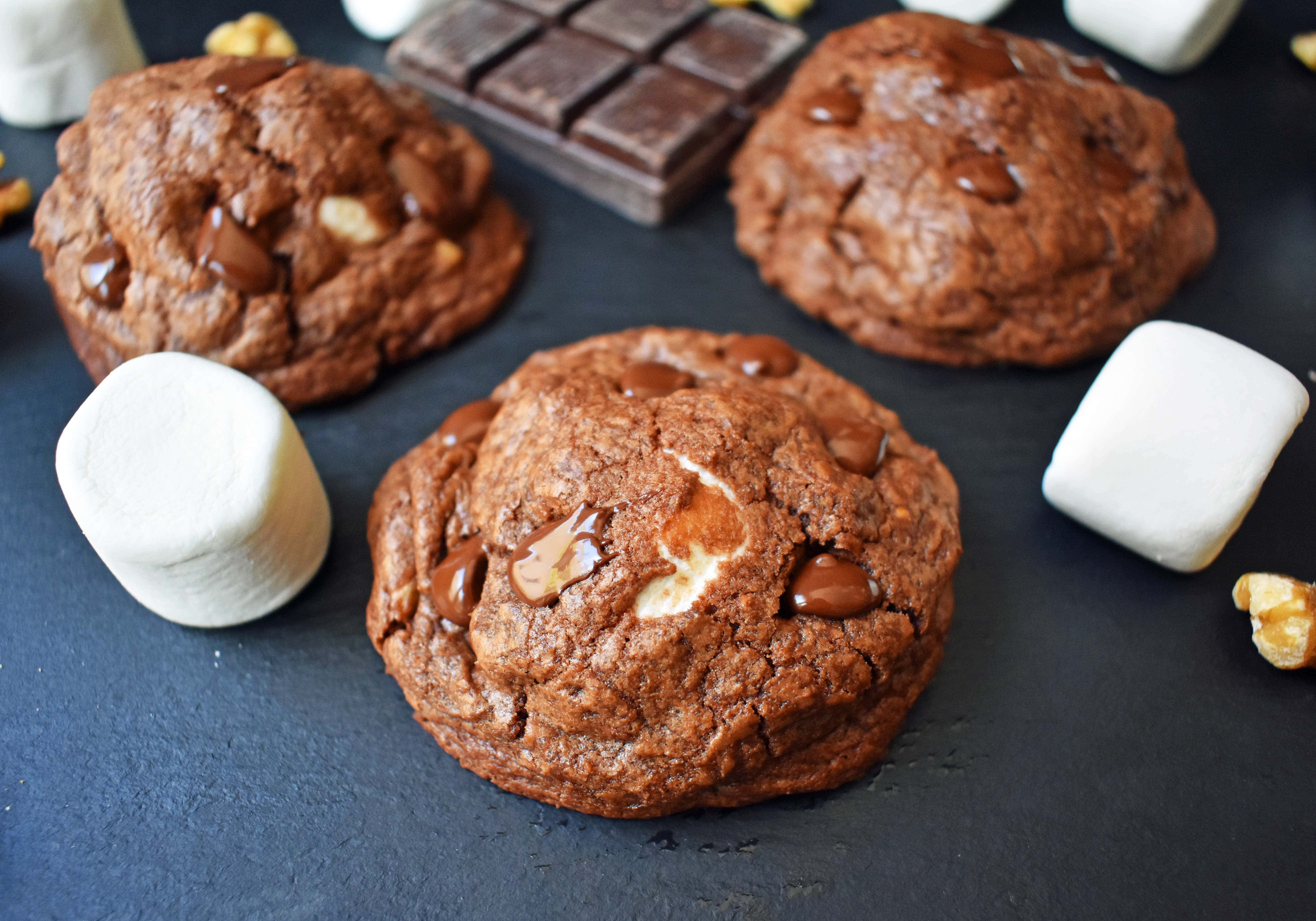 Rocky Road Fudge Cookies. Rich chocolate cookie dough stuffed with melted marshmallow and walnuts. Rocky Road fudge and a cookie rolled into one. Chocolate marshmallow lovers will go crazy for this cookie! www.modernhoney.com