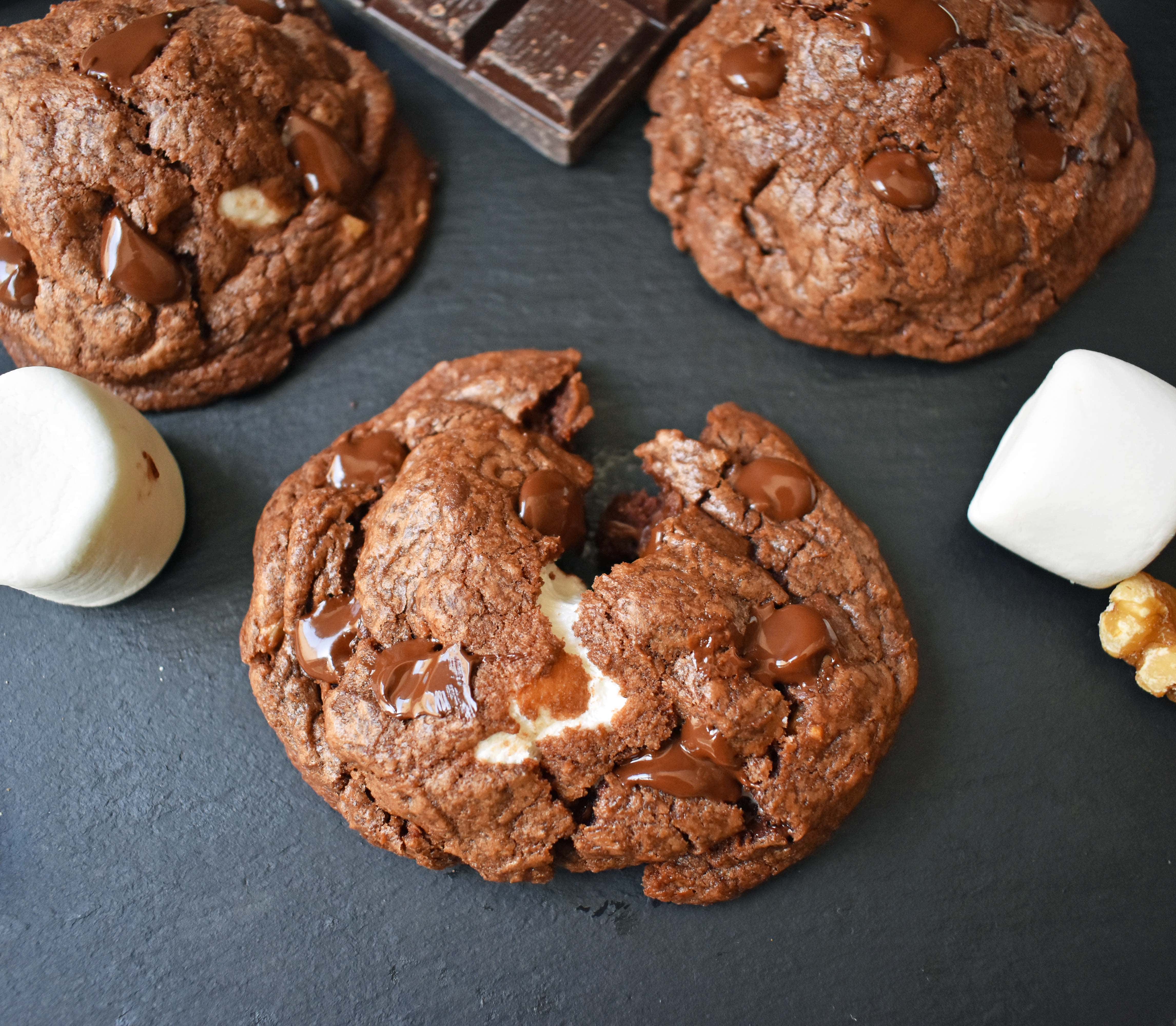 Rocky Road Fudge Cookies. Rich chocolate cookie dough stuffed with melted marshmallow and walnuts. Rocky Road fudge and a cookie rolled into one. Chocolate marshmallow lovers will go crazy for this cookie! www.modernhoney.com