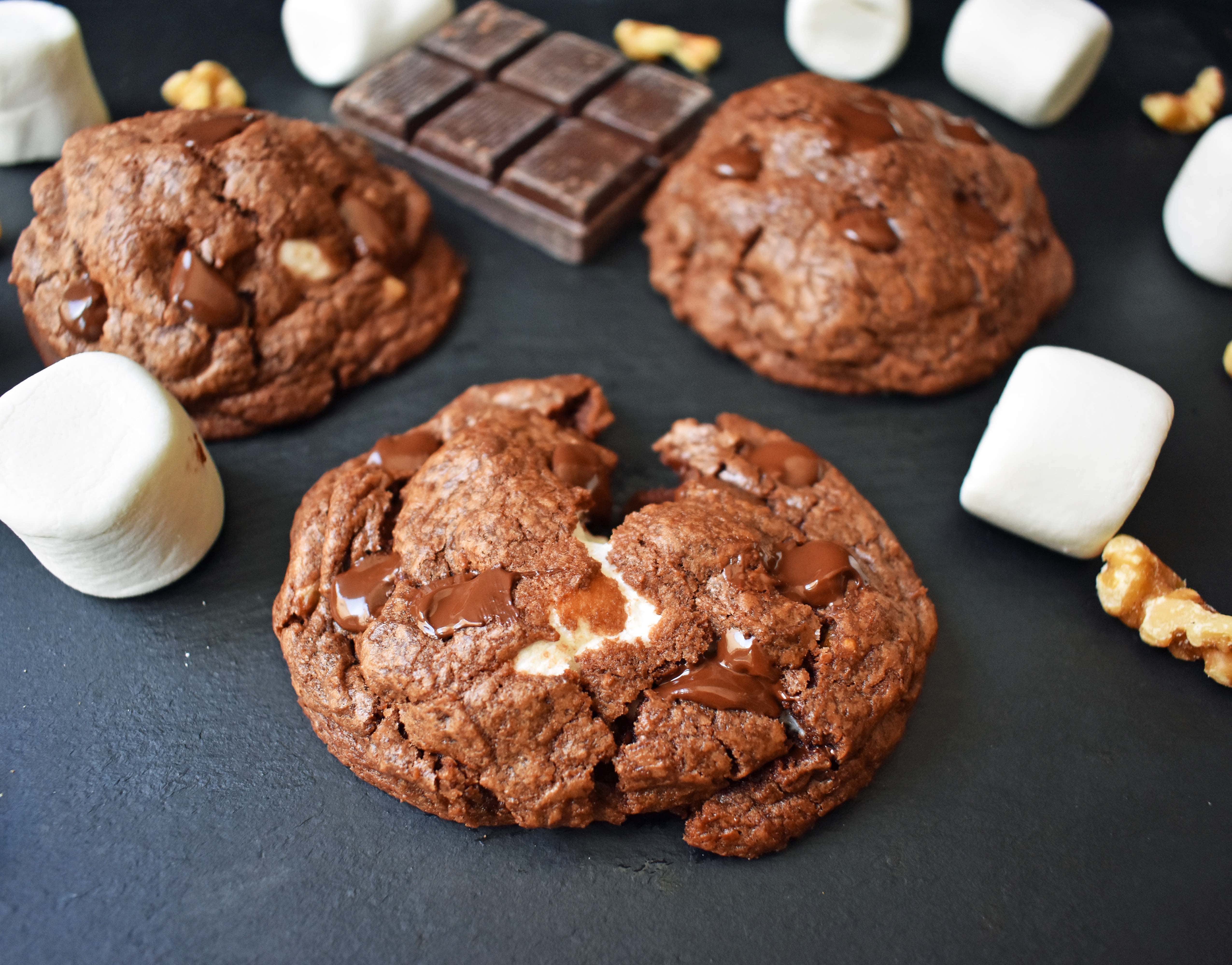 Rocky Road Fudge Cookies. Rich chocolate cookie dough stuffed with melted marshmallow and walnuts. Rocky Road fudge and a cookie rolled into one. Chocolate marshmallow lovers will go crazy for this cookie! www.modernhoney.com