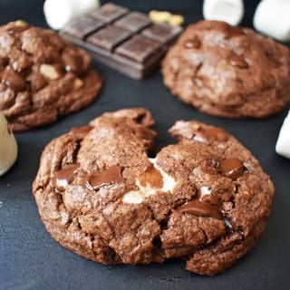 Rocky Road Fudge Cookies. Rich chocolate cookie dough stuffed with melted marshmallow and walnuts. Rocky Road fudge and a cookie rolled into one. Chocolate marshmallow lovers will go crazy for this cookie! www.modernhoney.com