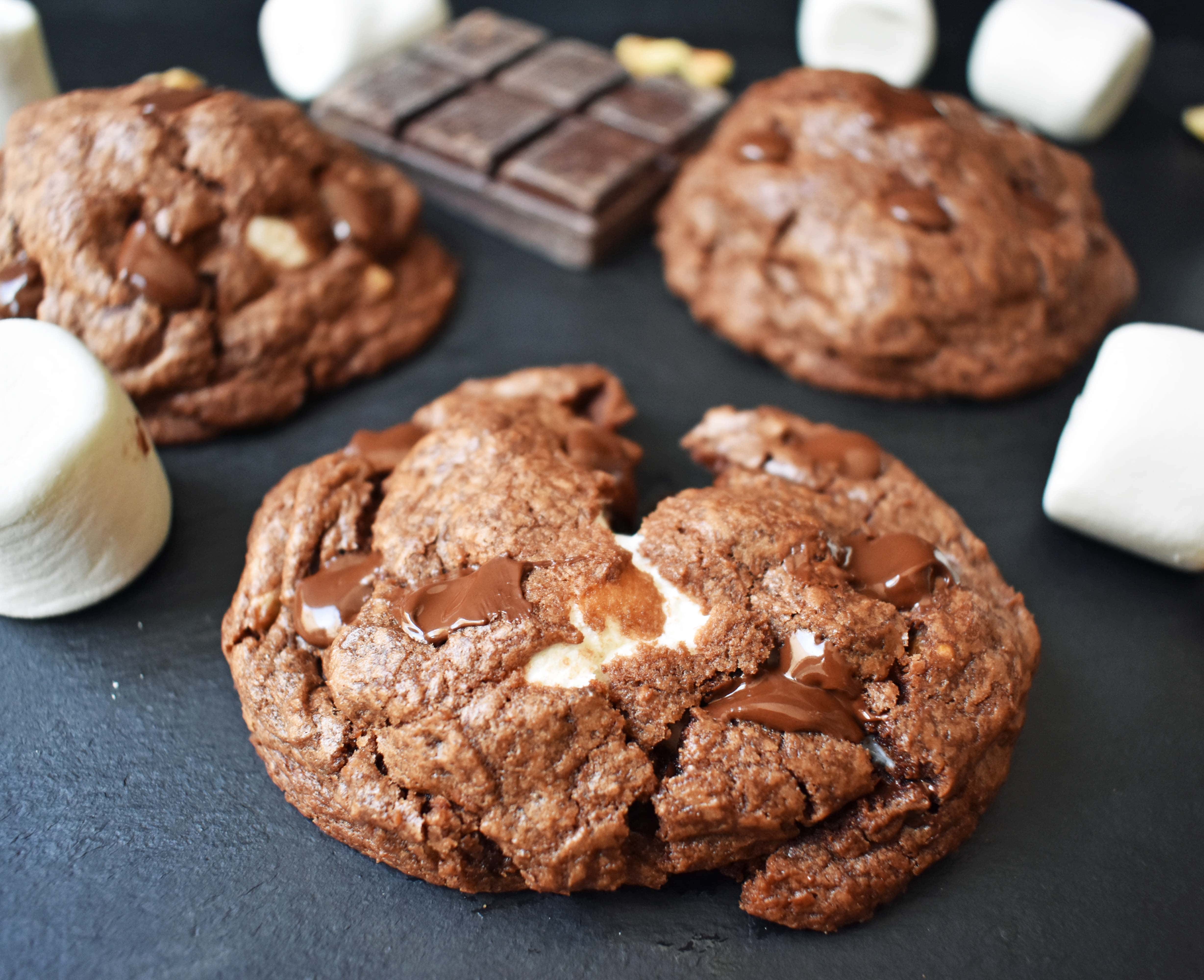 Rocky Road Fudge Cookies. Rich chocolate cookie dough stuffed with melted marshmallow and walnuts. Rocky Road fudge and a cookie rolled into one. Chocolate marshmallow lovers will go crazy for this cookie! www.modernhoney.com