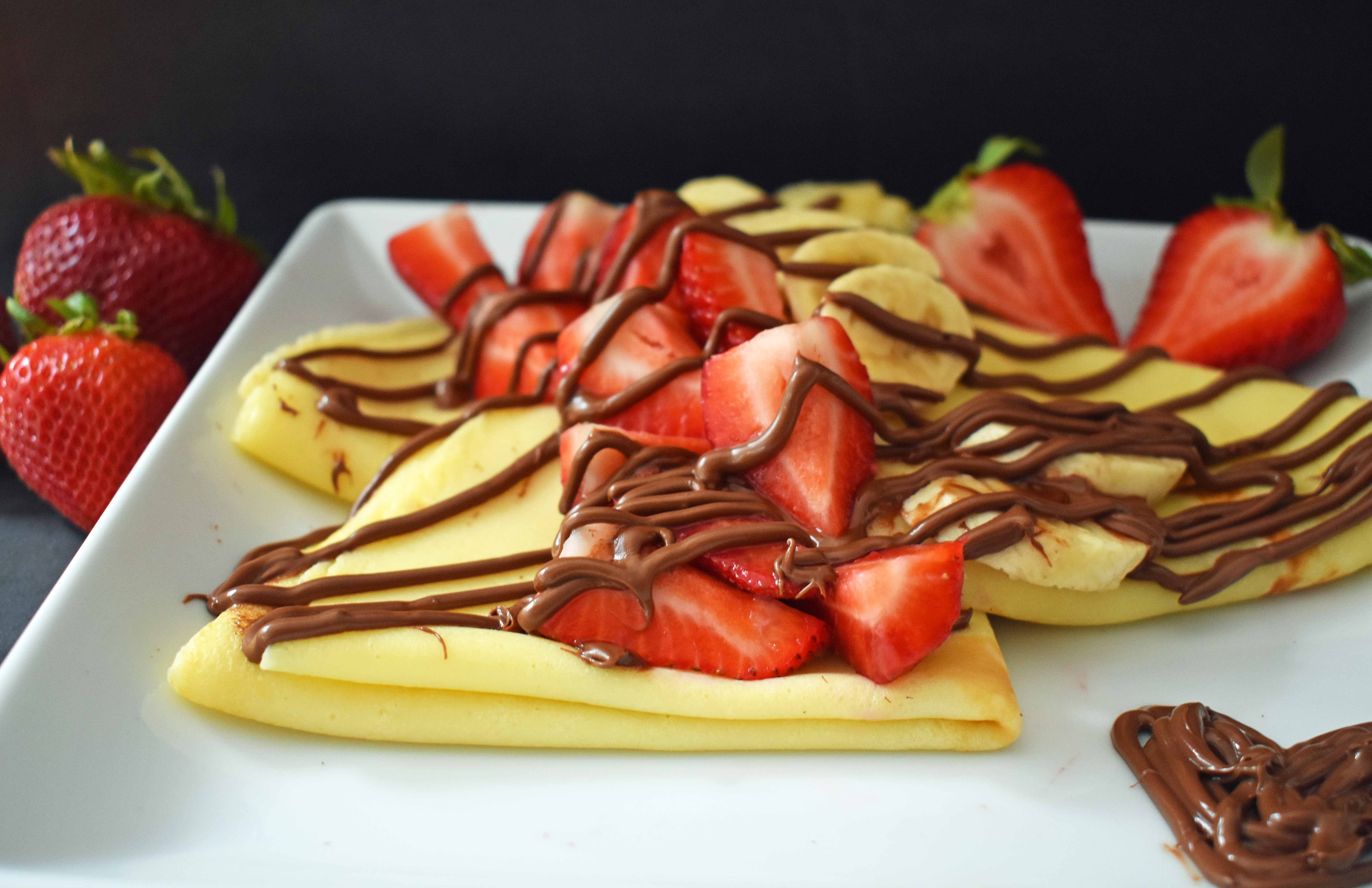 Perfect Crepes Recipe with Nutella and Strawberries. Buttery French crepes that melt-in-your-mouth. A list of crepe topping ideas and where to buy the best crepe pans. www.modernhoney.com