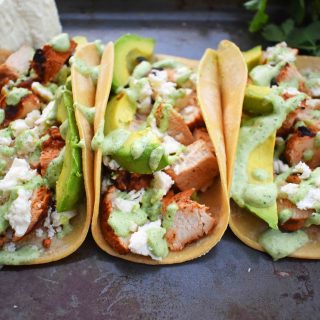 Grilled Chicken Tacos with Roasted Poblano Crema. Chili lime marinated chicken tacos topped with roasted poblano cream sauce, queso fresco cheese, and fresh avocado. www.modernhoney.com