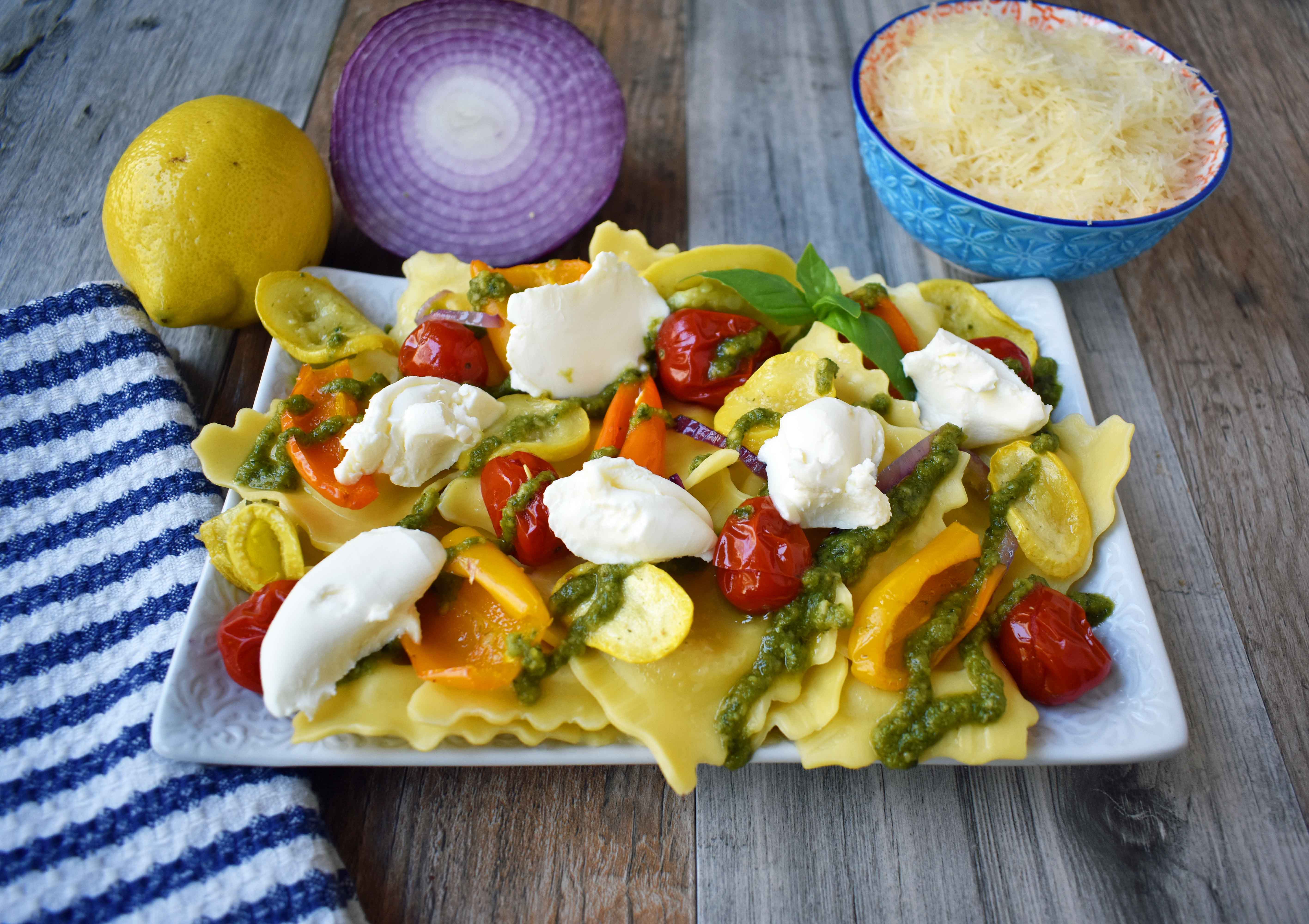 Summer Roasted Vegetable Pesto Ravioli by Modern Honey. This light and fresh summer pasta dish is made with fresh ravioli, tender roasted vegetables, basil pesto sauce, and a touch of mascarpone cheese. A vibrant and healthy pasta dish. www.modernhoney.com