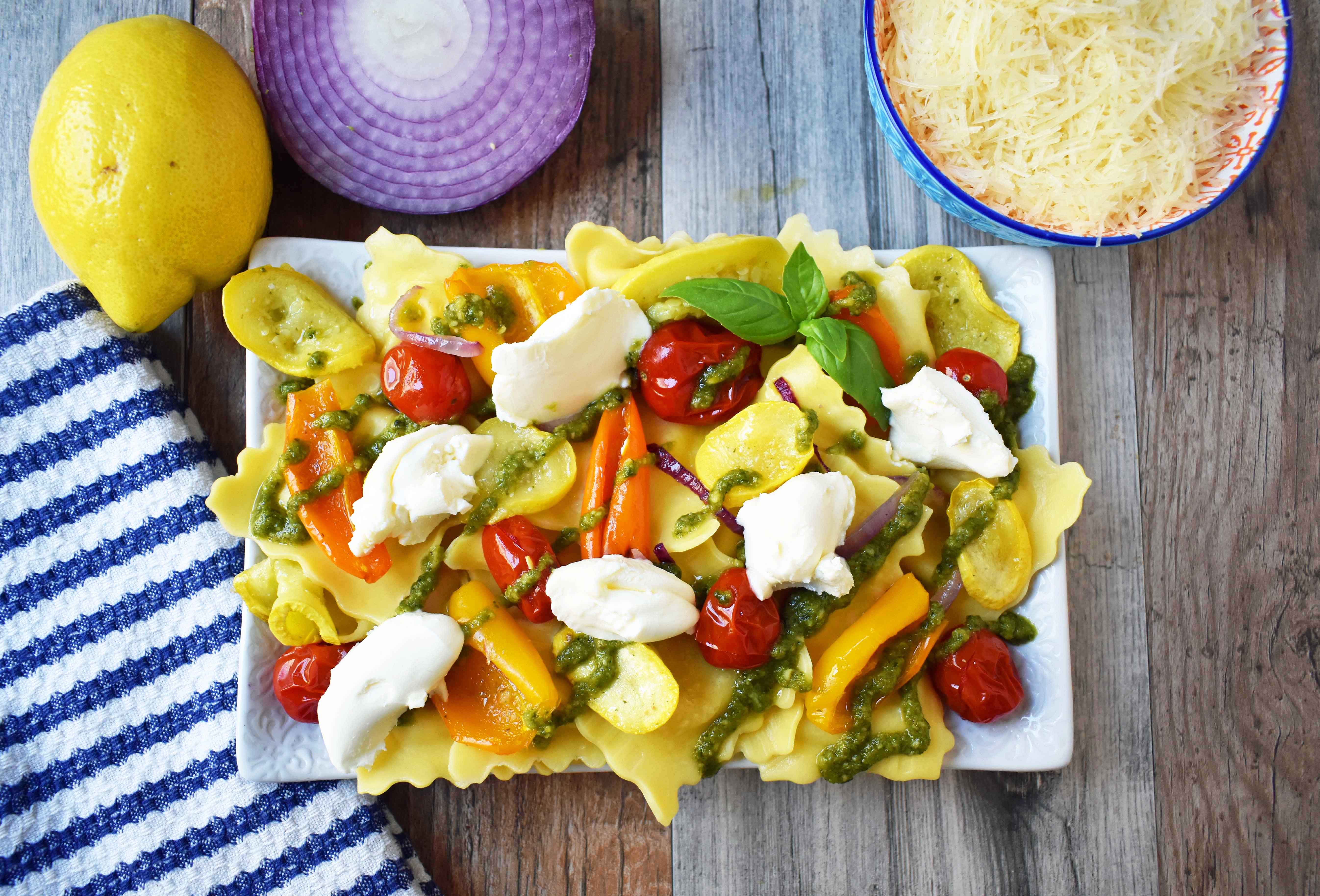 Summer Roasted Vegetable Pesto Ravioli by Modern Honey. This light and fresh summer pasta dish is made with fresh ravioli, tender roasted vegetables, basil pesto sauce, and a touch of mascarpone cheese. A vibrant and healthy pasta dish. www.modernhoney.com