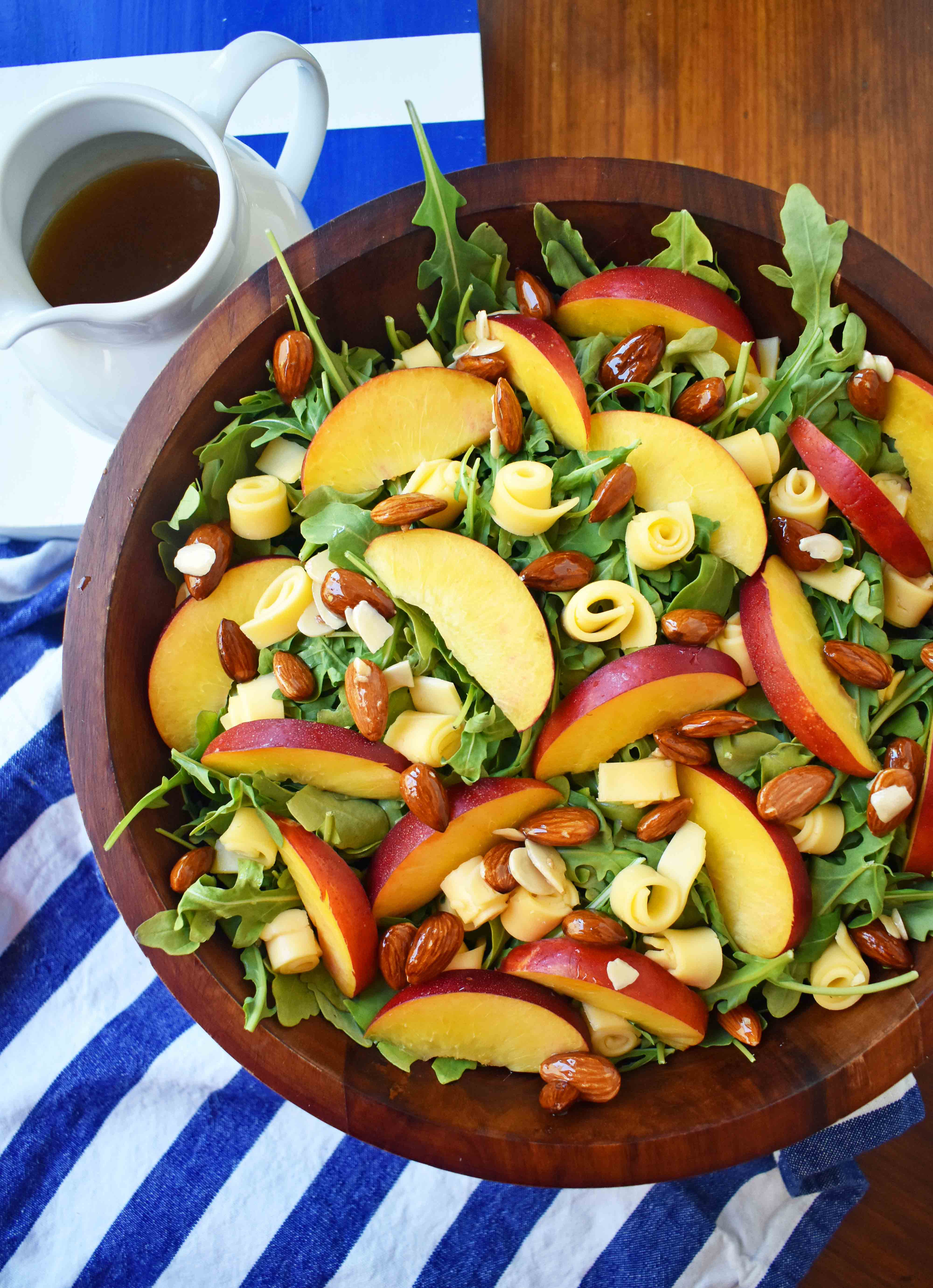 Peach Gouda Honey Almond Salad. Arugula, Creamy Gouda Cheese, Sweet Peaches or Nectarines, and Honey Glazed Almonds tossed with a Sweet Honey Dressing. www.modernhoney.com