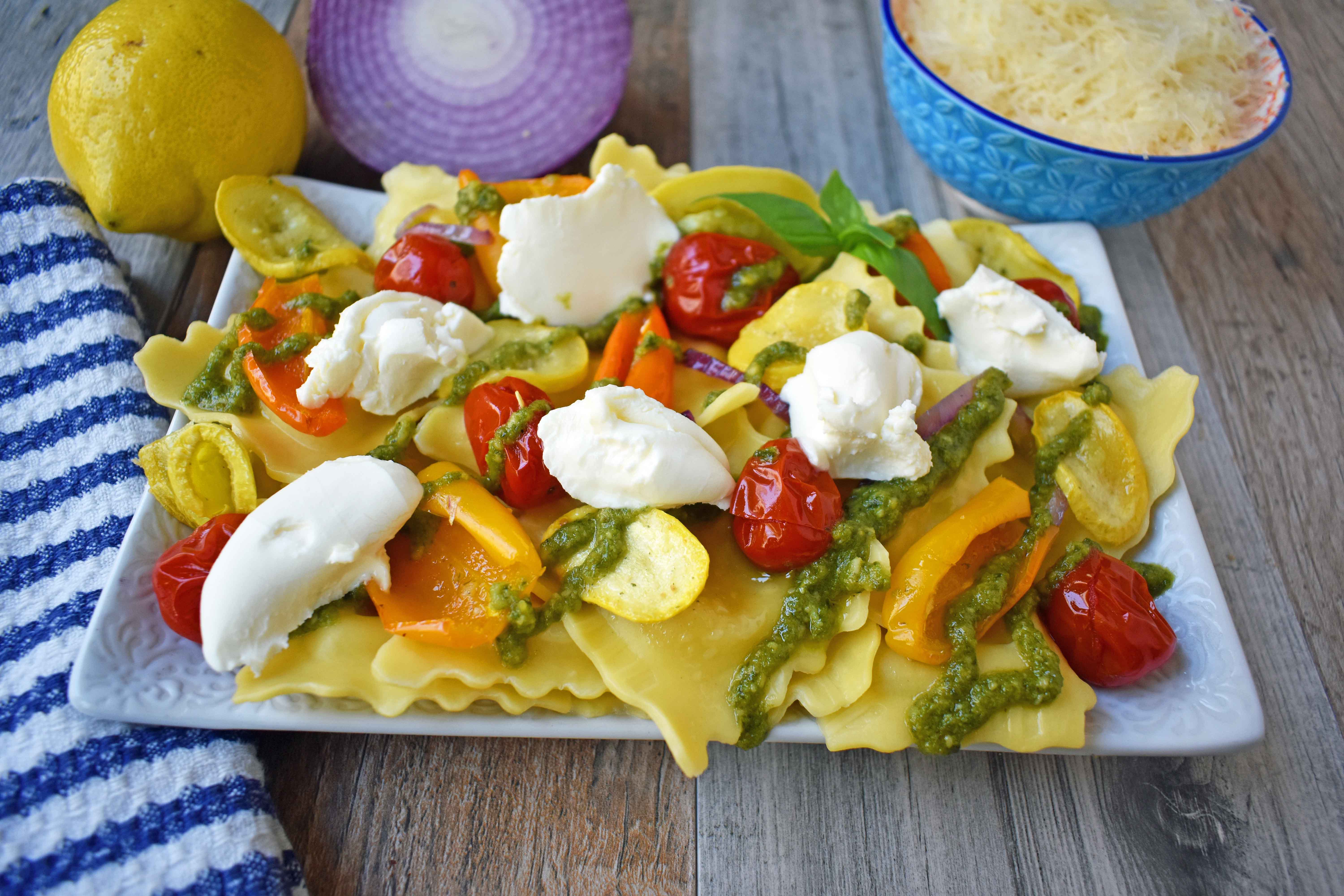 Summer Roasted Vegetable Pesto Ravioli by Modern Honey. This light and fresh summer pasta dish is made with fresh ravioli, tender roasted vegetables, basil pesto sauce, and a touch of mascarpone cheese. A vibrant and healthy pasta dish. www.modernhoney.com