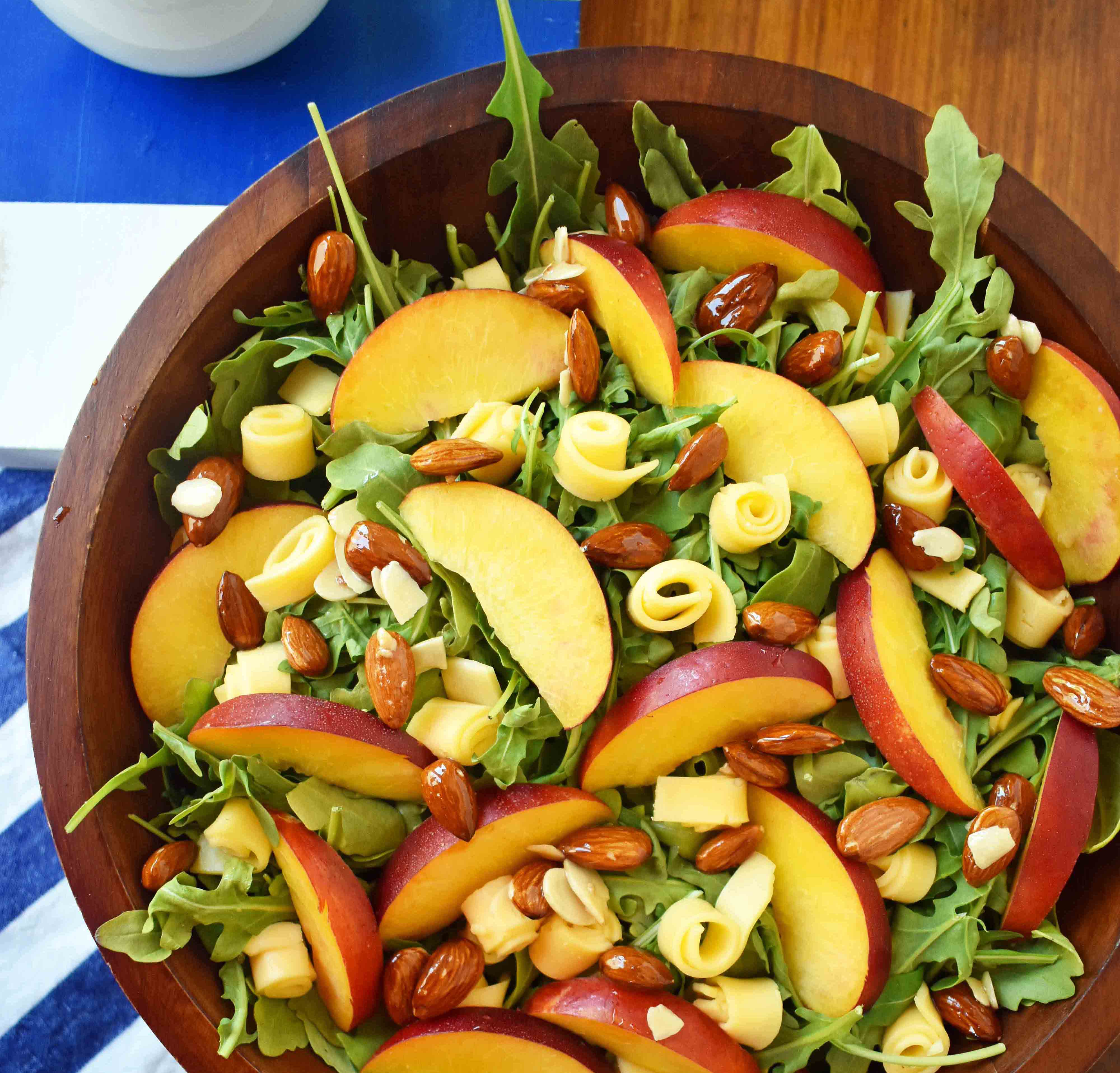 Peach Gouda Honey Almond Salad. Arugula, Creamy Gouda Cheese, Sweet Peaches or Nectarines, and Honey Glazed Almonds tossed with a Sweet Honey Dressing. www.modernhoney.com