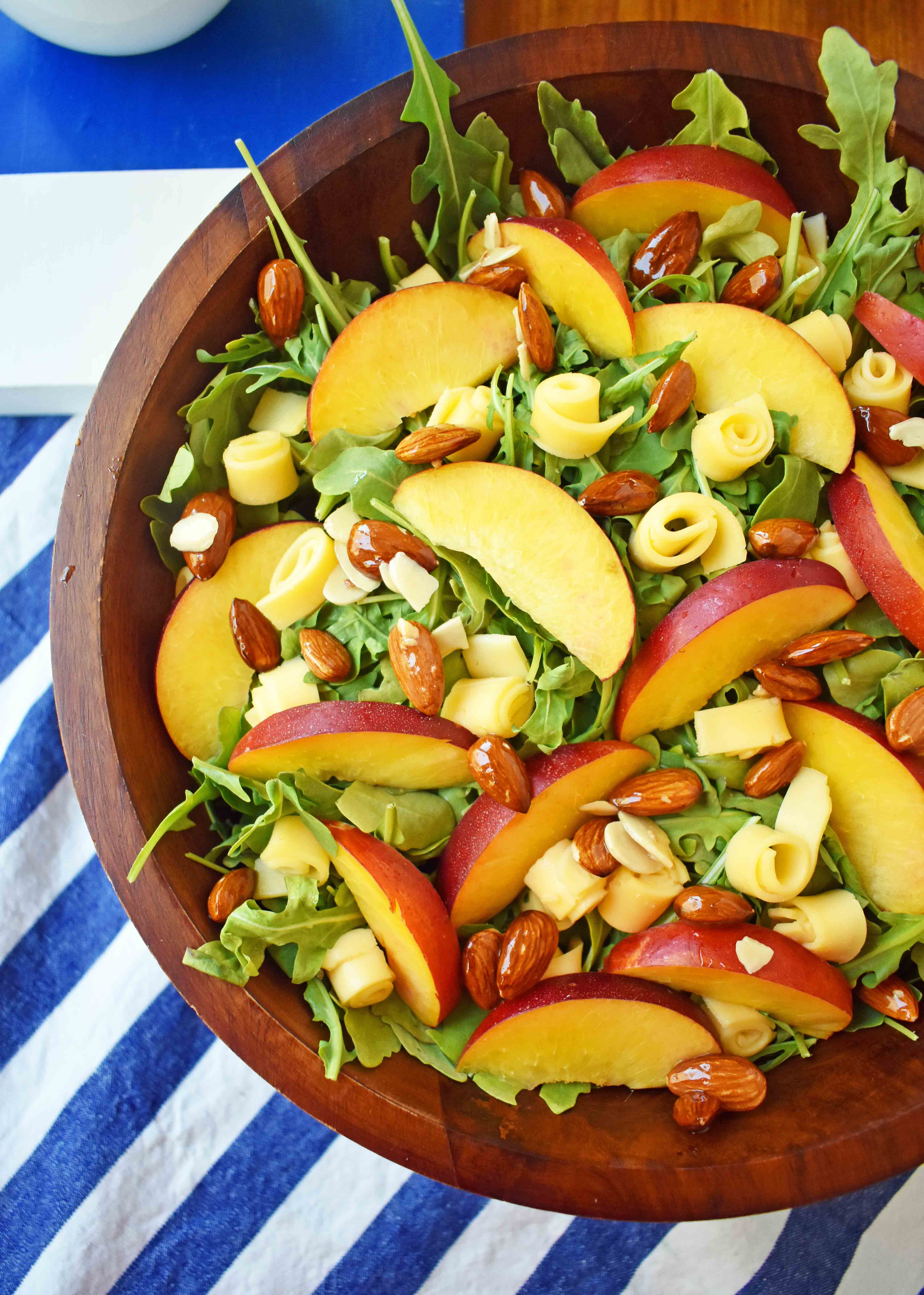 Peach Gouda Honey Almond Salad. Arugula, Creamy Gouda Cheese, Sweet Peaches or Nectarines, and Honey Glazed Almonds tossed with a Sweet Honey Dressing. www.modernhoney.com