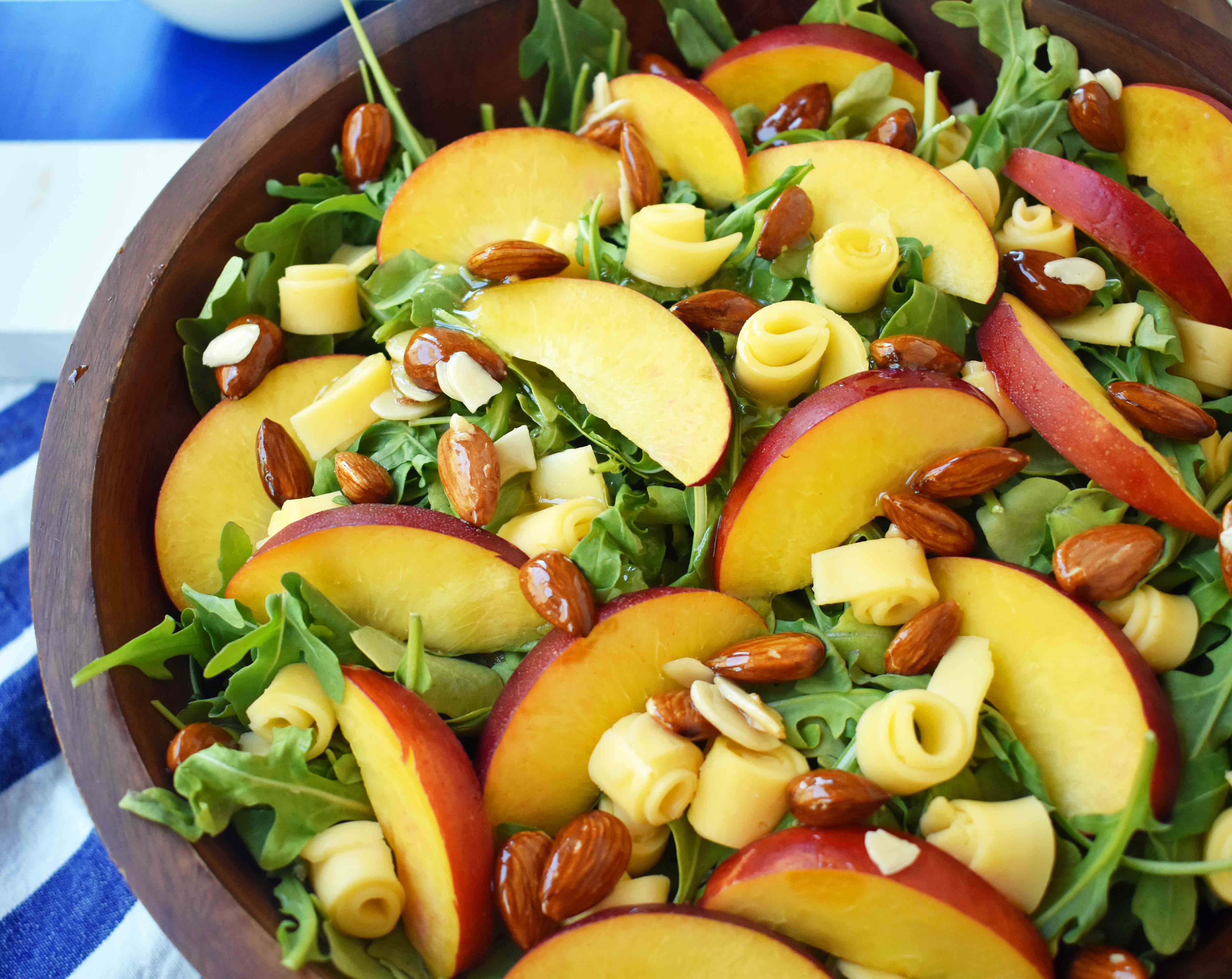 Peach Gouda Honey Almond Salad. Arugula, Creamy Gouda Cheese, Sweet Peaches or Nectarines, and Honey Glazed Almonds tossed with a Sweet Honey Dressing. www.modernhoney.com