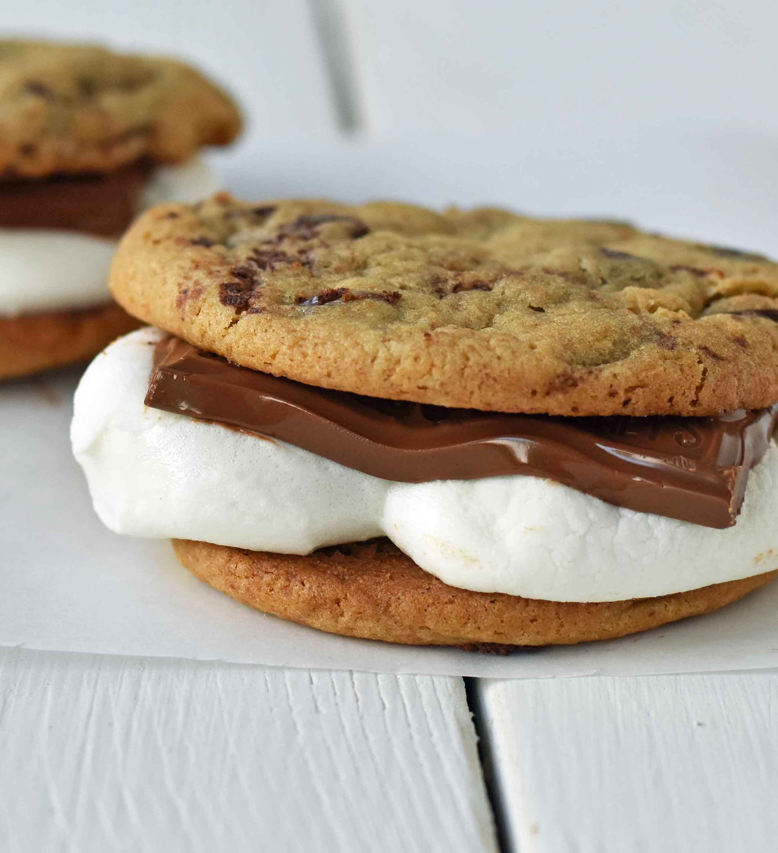 Chocolate Chip Cookie S'mores. Warm, homemade chocolate chip cookies sandwiched with melted toasted marshmallow and rich milk chocolate. The ultimate s'mores. www.modernhoney.com