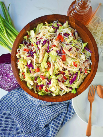 Chinese Chicken Salad with crunchy cabbage, tender chicken, green onions, red pepper, almonds, all tossed in a honey ginger dressing. May add rice or soba noodles if you so desire. A gluten- free and dairy-free Chinese Chicken Noodle Salad. A healthy salad that is perfect for a potluck. www.modernhoney.com