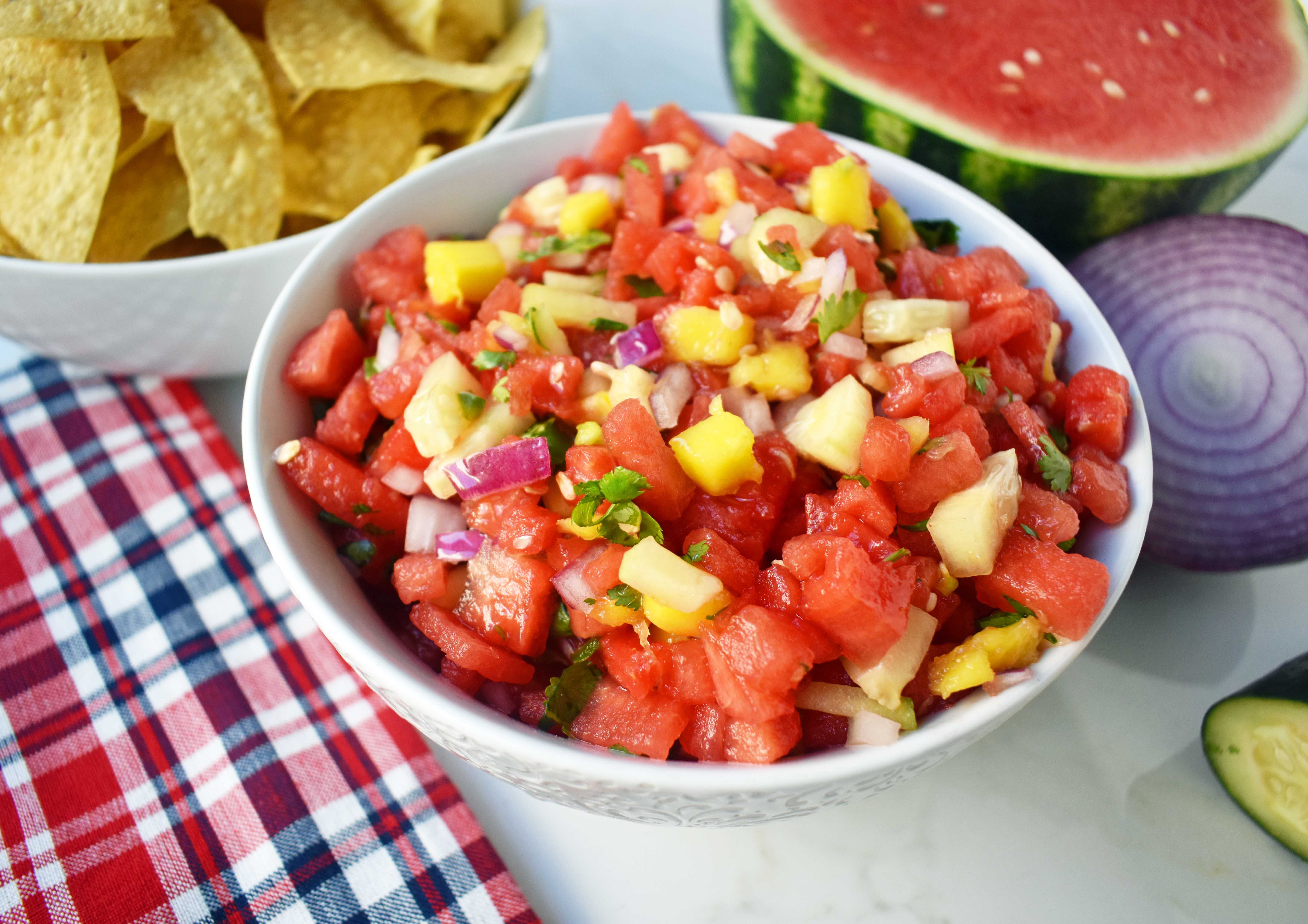 Watermelon Mango Salsa made with fresh watermelon, sweet mango, crisp cucumber, red onion, cilantro, jalapeno and a touch of honey. A sweet and spicy summer salsa. www.modernhoney.com