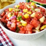 Watermelon Mango Salsa made with fresh watermelon, sweet mango, crisp cucumber, red onion, cilantro, jalapeno and a touch of honey. A sweet and spicy summer salsa. www.modernhoney.com
