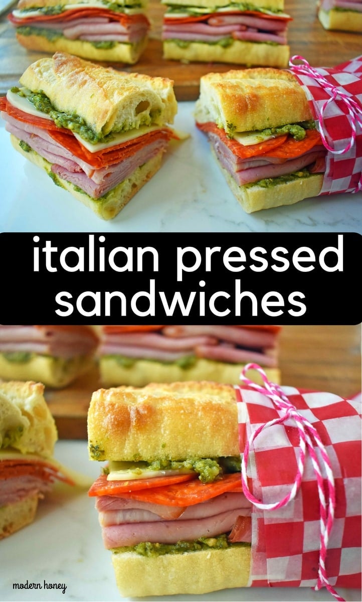 Italian Pressed Sandwiches made with rustic French bread layered with Italian meats and cheeses, pesto sauce or olive oil and vinegar, and marinated tomatoes. This Italian Pressed Sandwich with pesto sauce is perfect for a picnic, kids lunch, or for a casual lunch. www.modernhoney.com