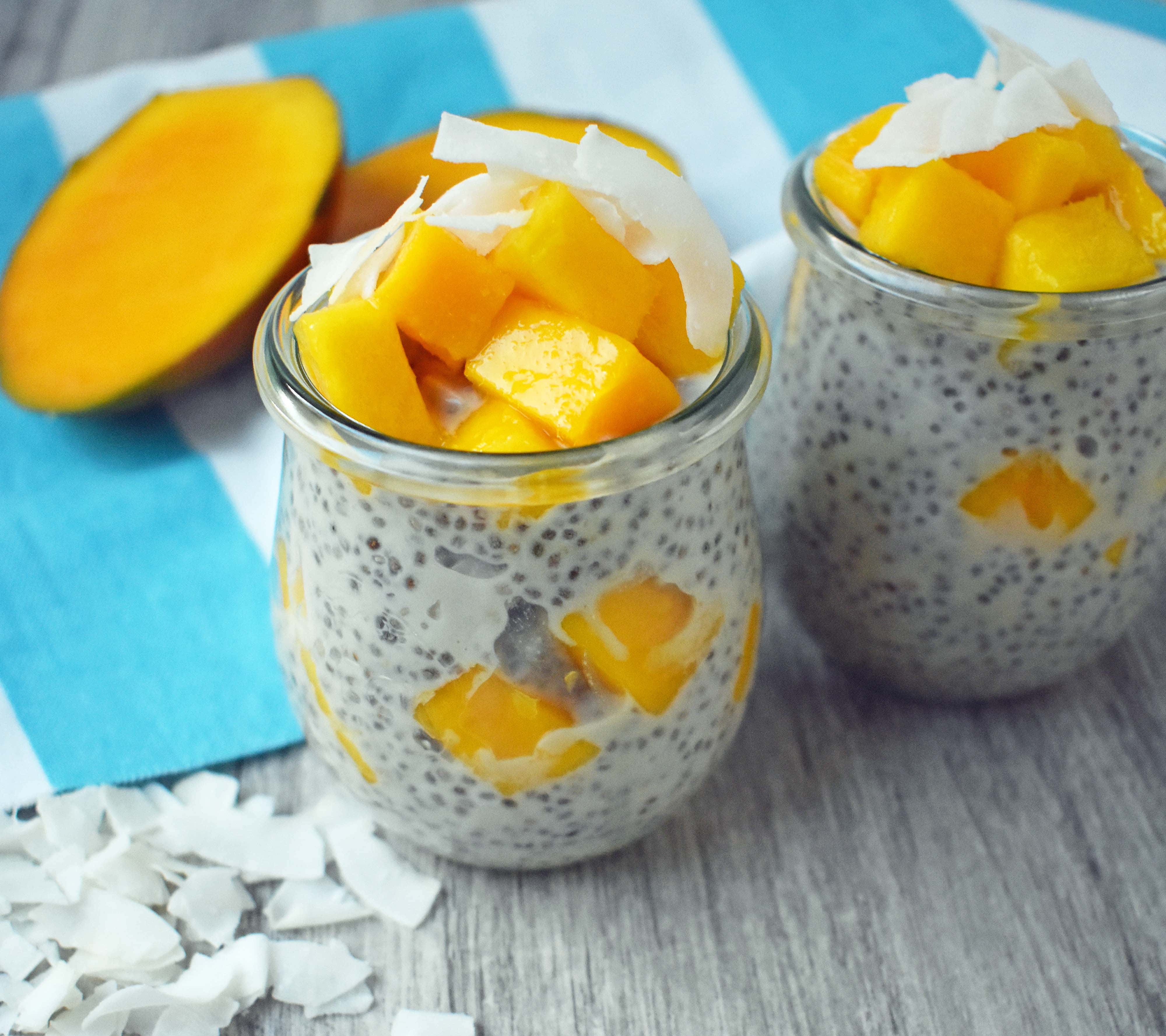 Coconut Mango Chia Pudding. A gluten-free, sugar-free, dairy-free dessert. Omega rich chia seeds soaked in coconut milk and sweetened with real maple syrup. Topped with unsweetned coconut flakes and fresh mango for a healthy tropical treat. www.modernhoney.com