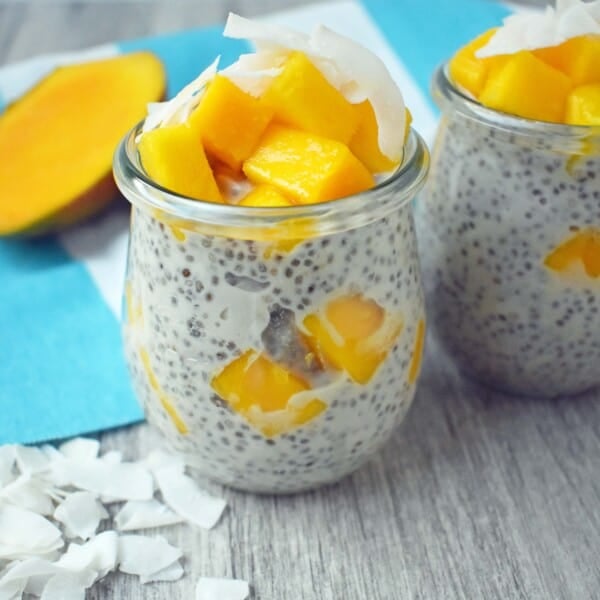 Coconut Mango Chia Pudding. A gluten-free, sugar-free, dairy-free dessert. Omega rich chia seeds soaked in coconut milk and sweetened with real maple syrup. Topped with unsweetned coconut flakes and fresh mango for a healthy tropical treat. www.modernhoney.com