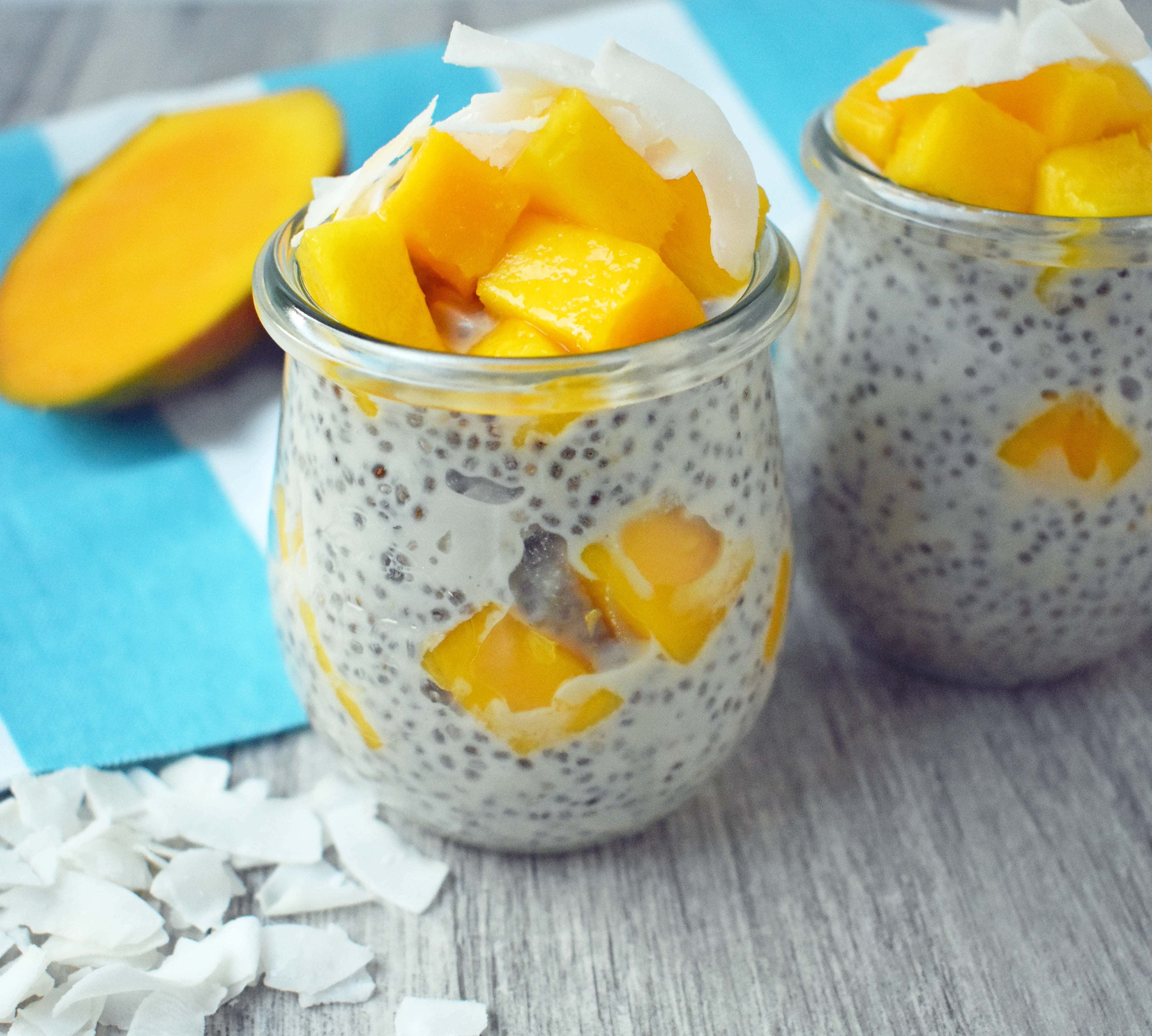 Coconut Mango Chia Pudding. A gluten-free, sugar-free, dairy-free dessert. Omega rich chia seeds soaked in coconut milk and sweetened with real maple syrup. Topped with unsweetned coconut flakes and fresh mango for a healthy tropical treat. www.modernhoney.com