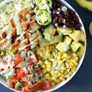 Grilled Chicken Burrito Bowls. Chipotle burrito bowls copycat recipe. Chili lime grilled chicken, pico de gallo, avocado, roasted corn, black beans, rice, and cilantro ranch dressing. A healthy mexican chicken taco bowl. www.modernhoney.com