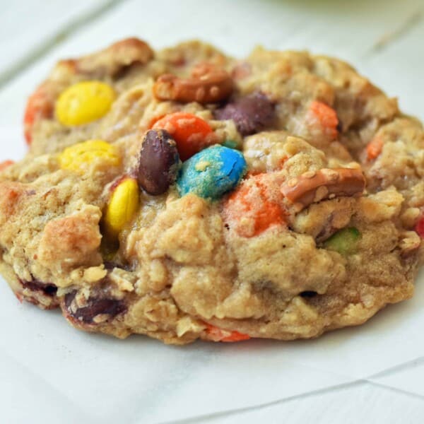 The Overachiever Oatmeal Pretzel M & M Cookie made with a sweet oatmeal cookie dough with oatmeal, shredded coconut, pretzels and M & M's. This Overachiever Cookie is the perfect balance of sweet and salty. www.modernhoney.com