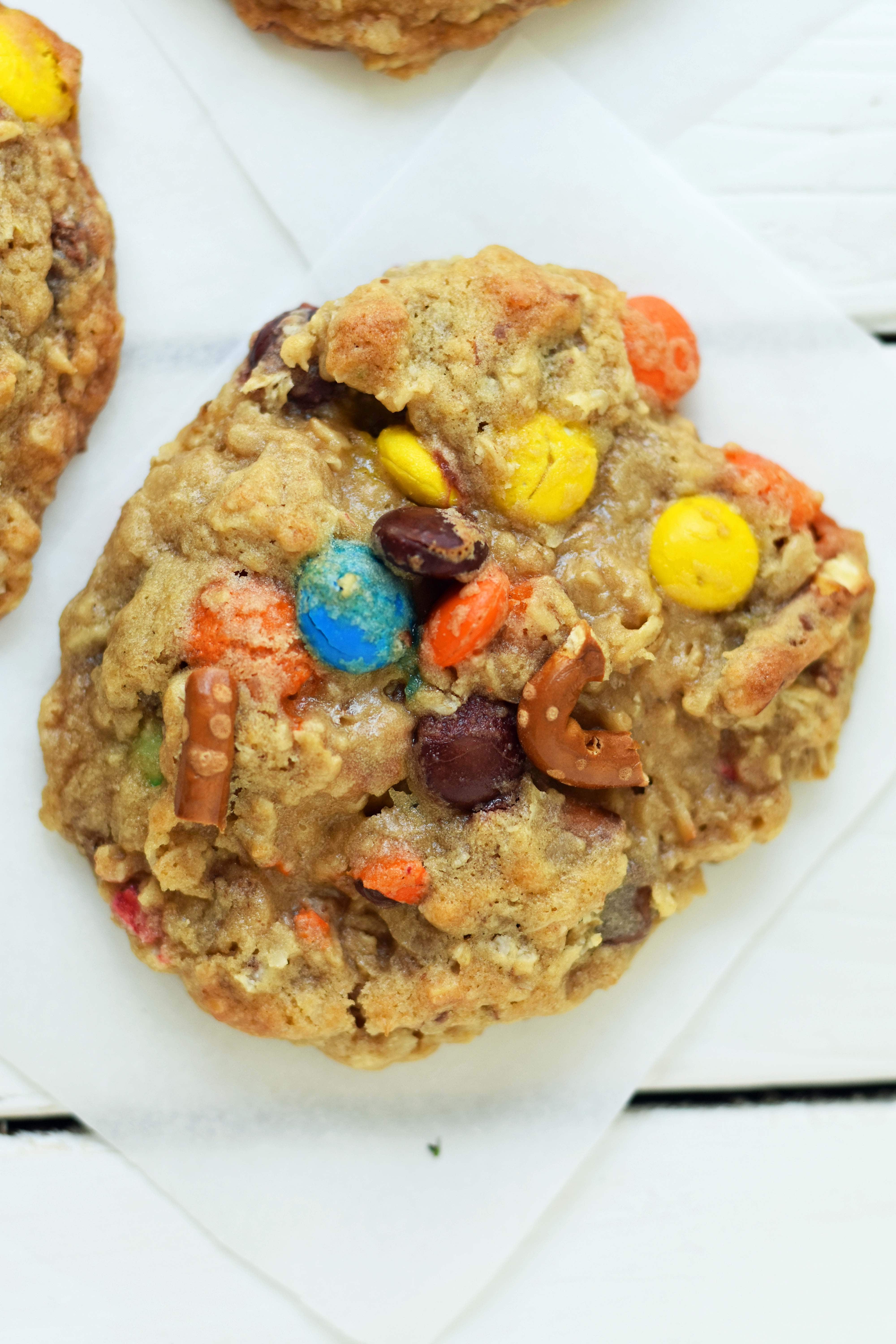 The Overachiever Oatmeal Pretzel M & M Cookie made with a sweet oatmeal cookie dough with oatmeal, shredded coconut, pretzels and M & M's. This Overachiever Cookie is the perfect balance of sweet and salty. www.modernhoney.com