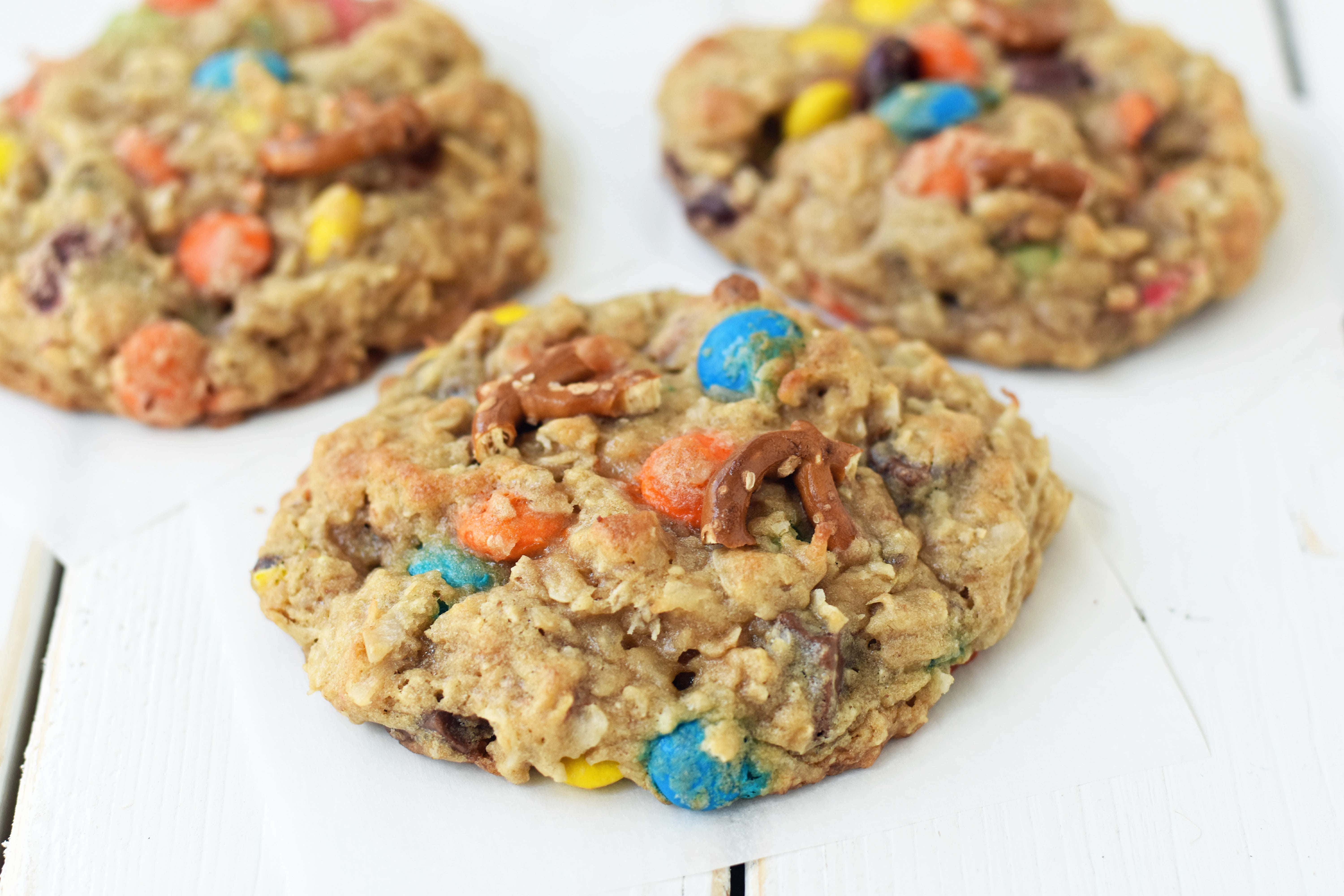 The Overachiever Oatmeal Pretzel M & M Cookie made with a sweet oatmeal cookie dough with oatmeal, shredded coconut, pretzels and M & M's. This Overachiever Cookie is the perfect balance of sweet and salty. www.modernhoney.com