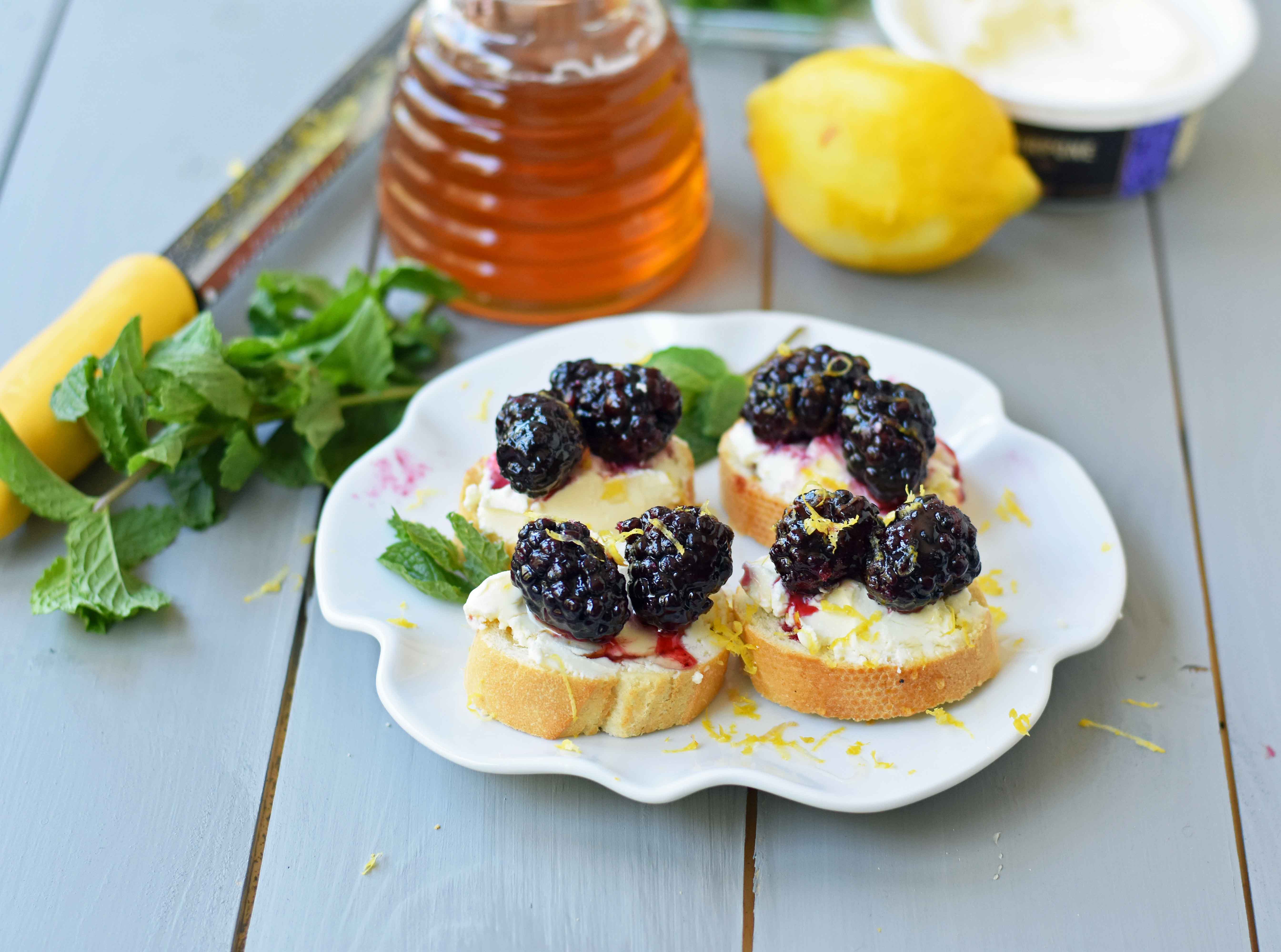 Blackberry and Lemon Mascarpone Crostini. A beautiful appetizer for a bridal shower, baby shower, party, festive holiday party, social gathering or for a dinner at home. A toasted baguette covered in creamy mascarpone cheese and topped with sugar marinated blackberries, fresh lemon zest, and a drizzle of honey. A sophisticated yet delicious appetizer. www.modernhoney.com