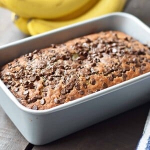 The best ever chocolate chip banana bread. Moist and delicious banana bread with chocolate chips. Banana bread made with butter, oil, and sour cream to create a perfect banana bread. www.modernhoney.com