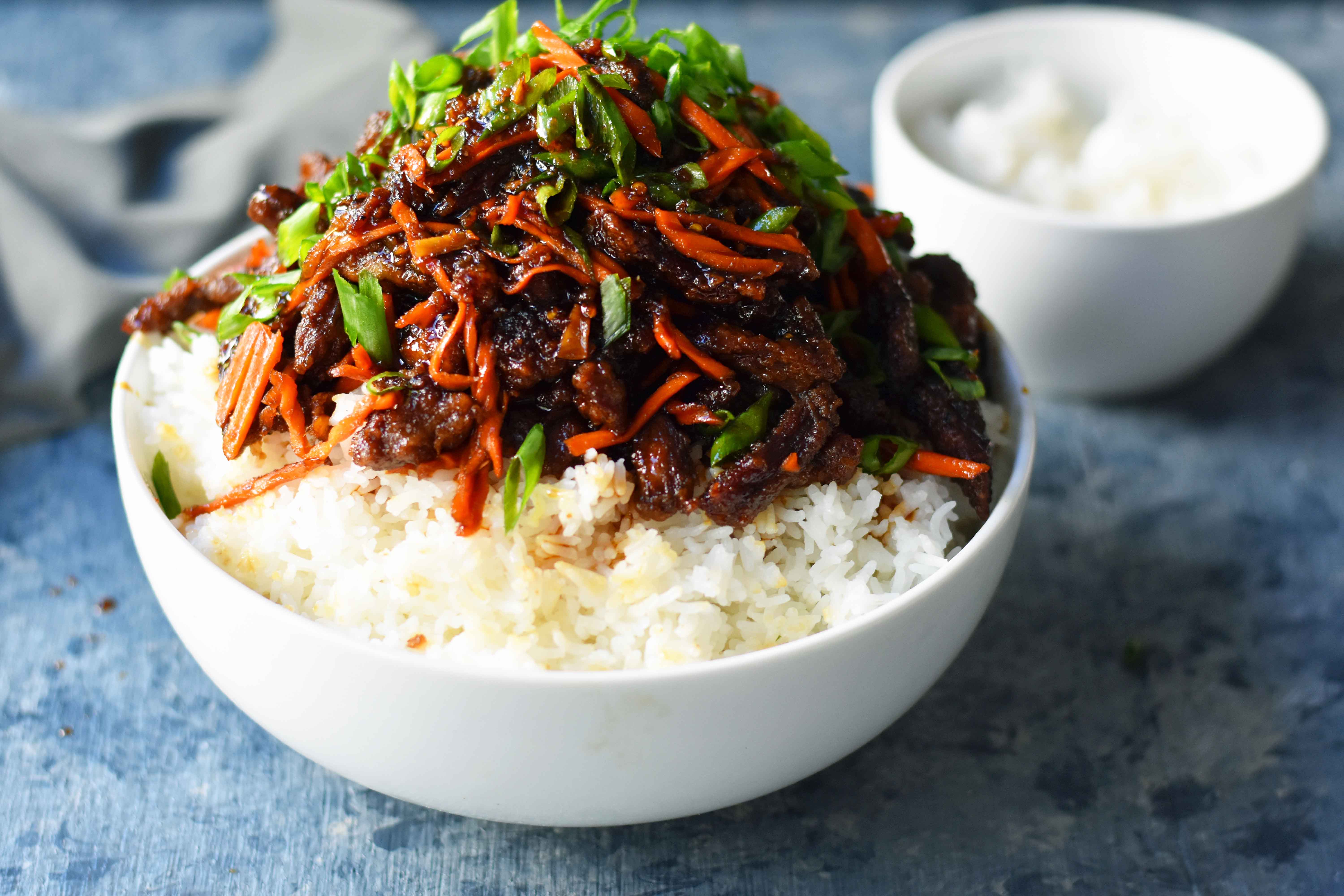 Mongolian Beef recipe. A P.F. Chang's Monglian Beef copycat recipe. Crispy beef in a sweet, salty, spicy sauce on a bed of rice. A popular asian dish. www.modernhoney.com