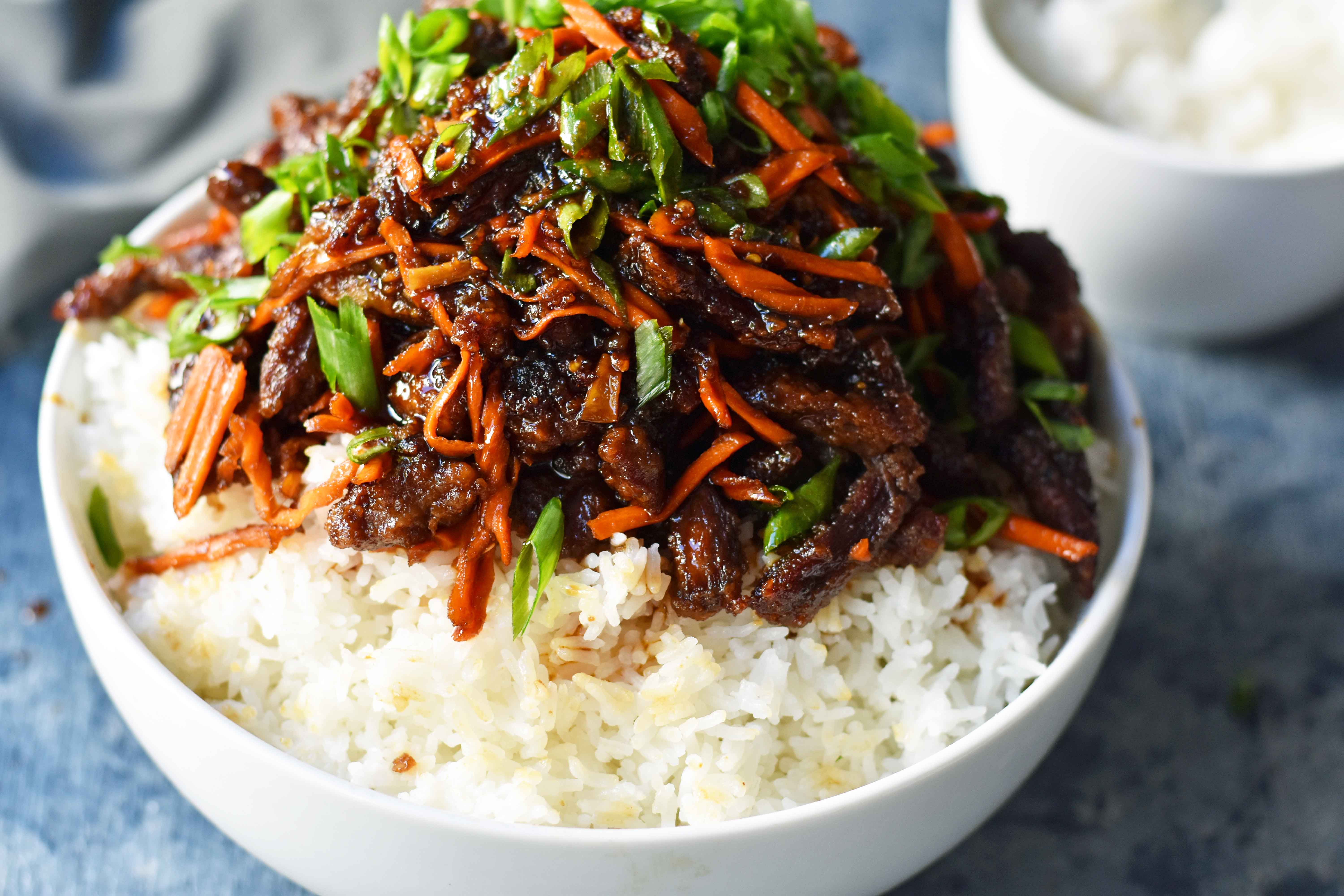 Mongolian Beef recipe. A P.F. Chang's Monglian Beef copycat recipe. Crispy beef in a sweet, salty, spicy sauce on a bed of rice. A popular asian dish. www.modernhoney.com
