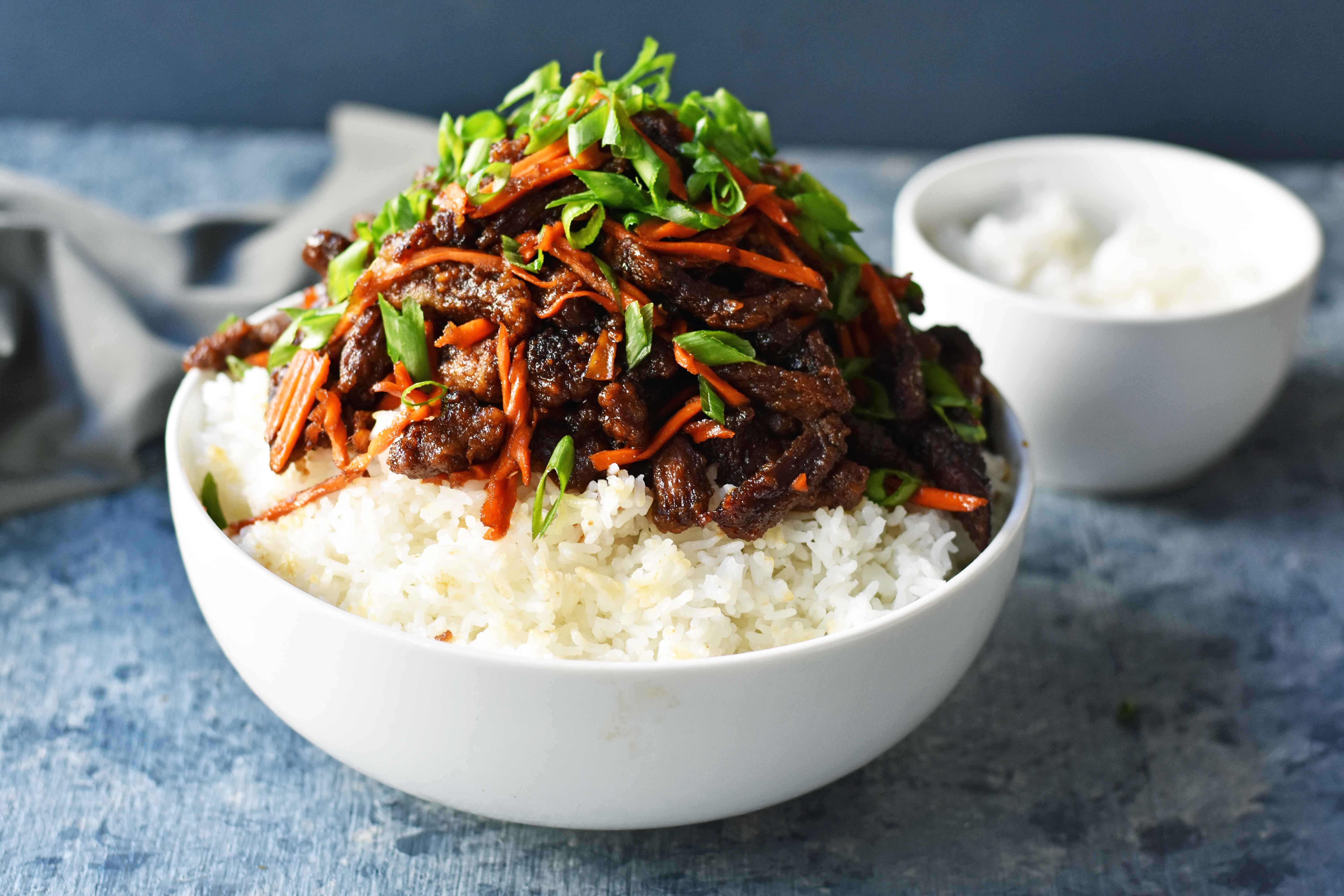 Mongolian Beef recipe. A P.F. Chang's Monglian Beef copycat recipe. Crispy beef in a sweet, salty, spicy sauce on a bed of rice. A popular asian dish. www.modernhoney.com