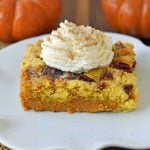 Pumpkin Praline Butter Dump Cake. Pumpkin custard filling baked with a buttery crunchy cake topping. This is the perfect pumpkin Fall dessert. www.modernhoney.com