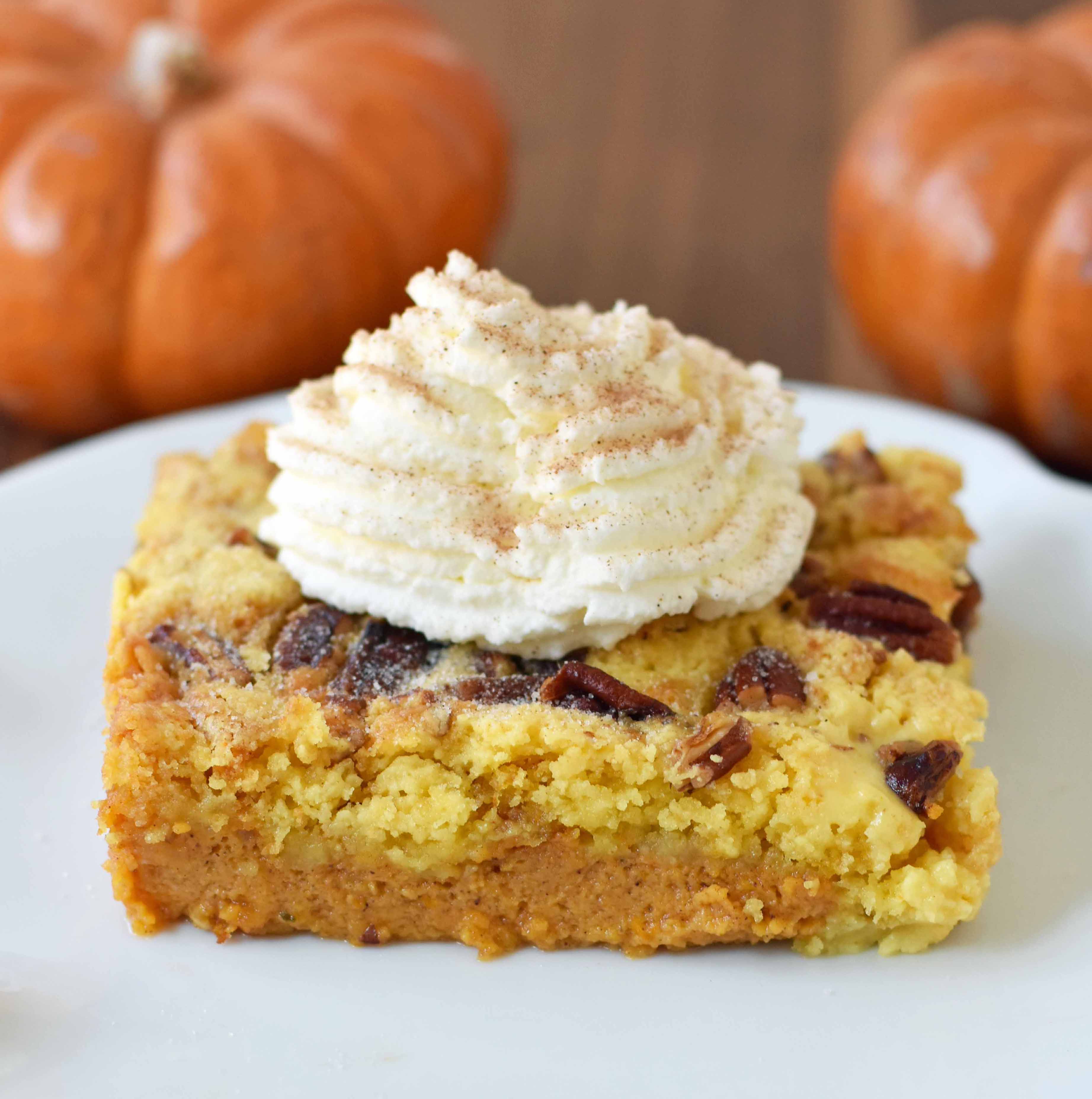 Pumpkin Praline Butter Dump Cake. Pumpkin custard filling baked with a buttery crunchy cake topping. This is the perfect pumpkin Fall dessert. www.modernhoney.com