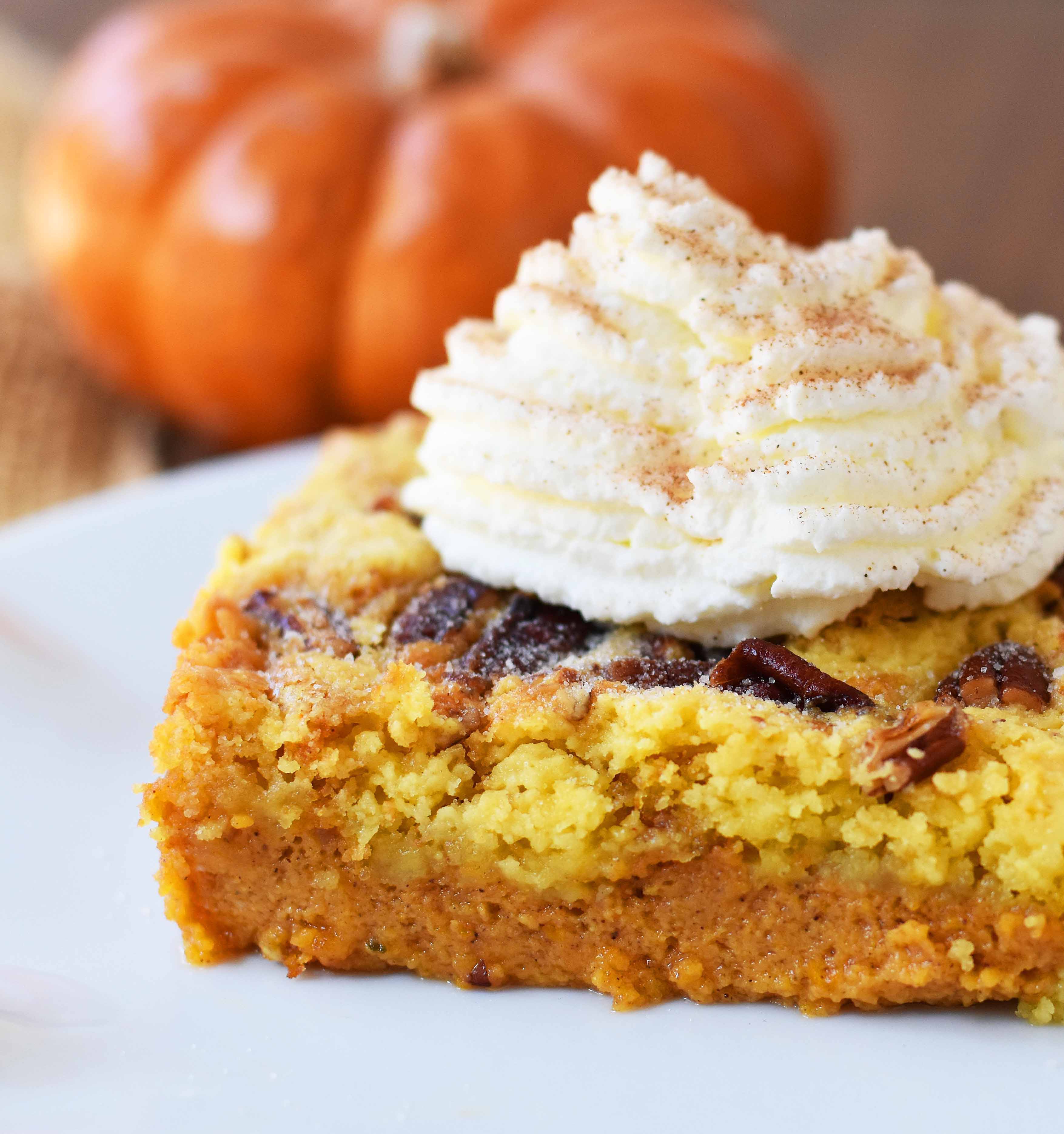 Pumpkin Praline Butter Dump Cake. Pumpkin custard filling baked with a buttery crunchy cake topping. This is the perfect pumpkin Fall dessert. www.modernhoney.com