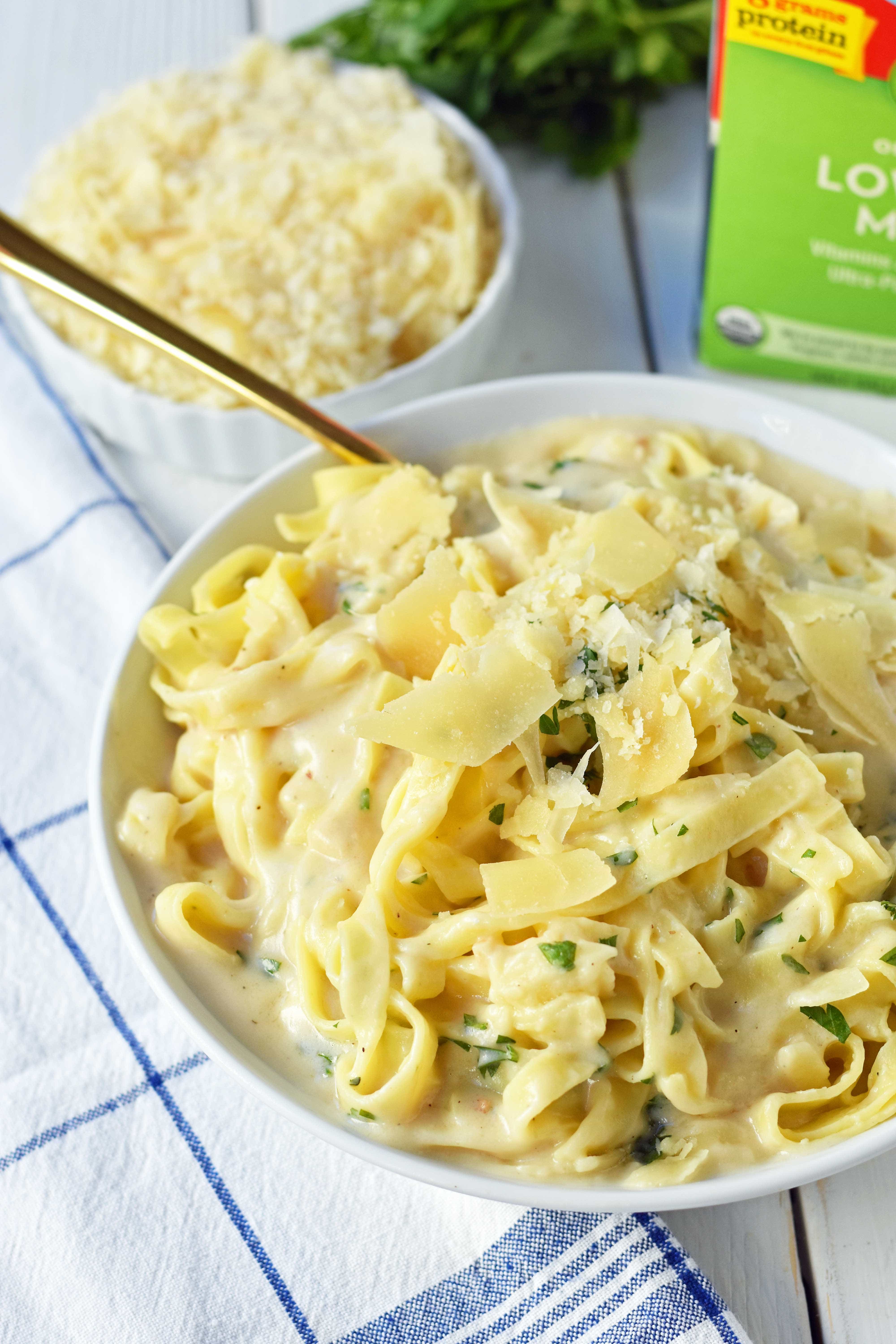 Skinny Fettuccine Alfredo is a low-fat version of America's favorite pasta dish. Rich and creamy fettuccine alfredo without all of the fat. This skinny fettuccine alfredo sauce is made with milk instead of heavy cream and has all of the flavor as the original. A 30-minute healthy meal that kids love. www.modernhoney.com