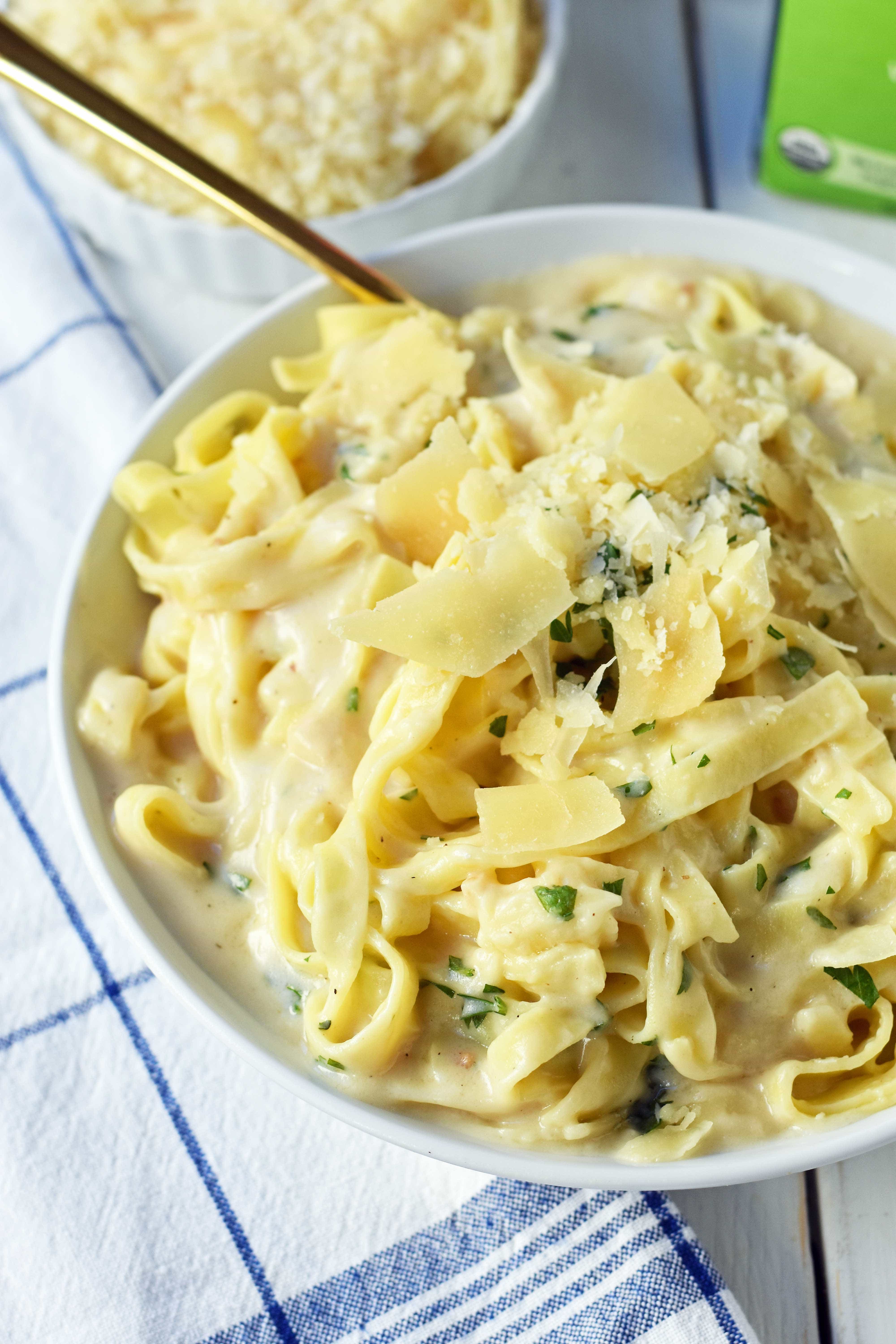 Skinny Fettuccine Alfredo is a low-fat version of America's favorite pasta dish. Rich and creamy fettuccine alfredo without all of the fat. This skinny fettuccine alfredo sauce is made with milk instead of heavy cream and has all of the flavor as the original. A 30-minute healthy meal that kids love. www.modernhoney.com